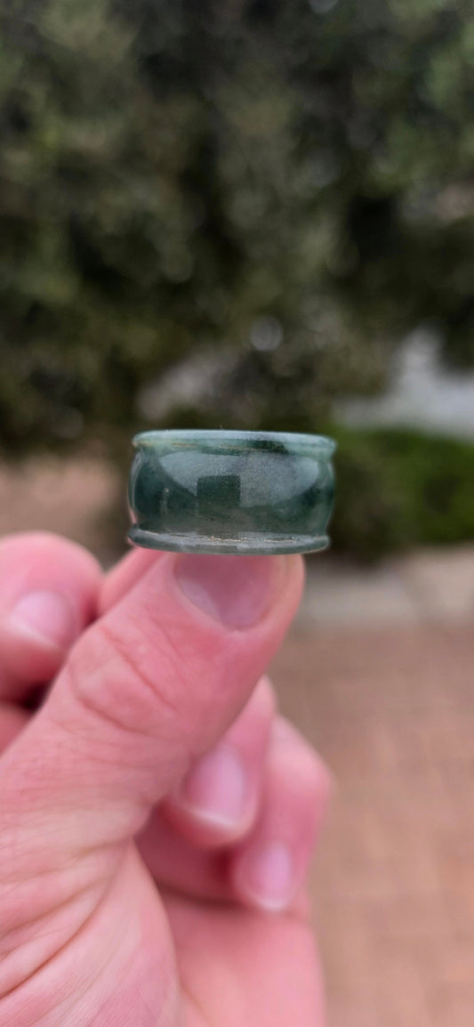 A wonderfully chunky unisex jade saddle ring, carved entirely from a single solid piece of natural green and white jade.