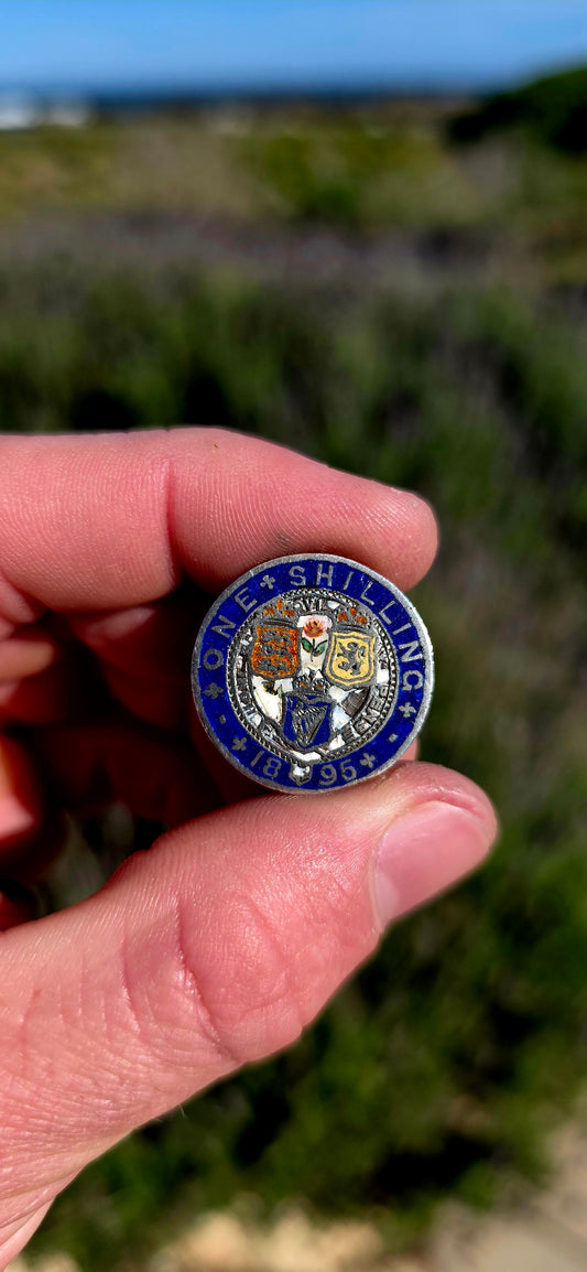 An antique 1895 British Sterling Silver One Shilling coin, beautifully transformed into a colourful enamelled sweetheart / love token.