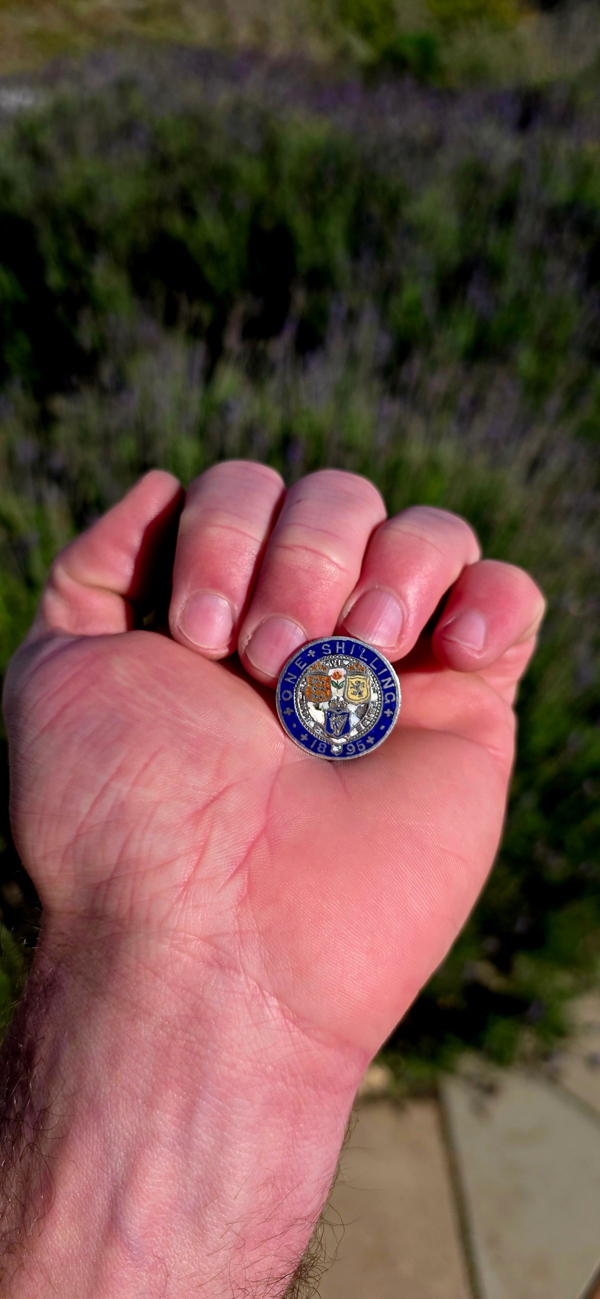 An antique 1895 British Sterling Silver One Shilling coin, beautifully transformed into a colourful enamelled sweetheart / love token.