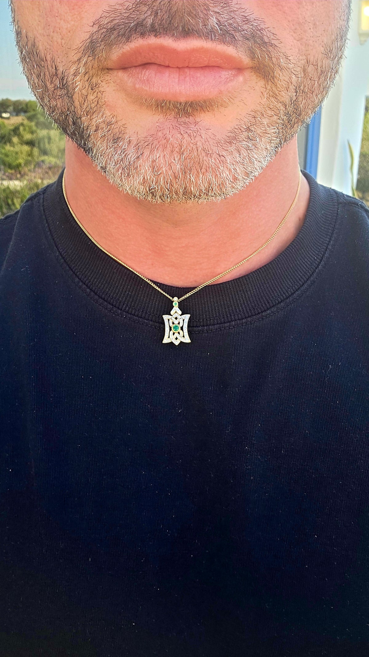 An elegant Art Deco Revival pendant, beautifully crafted in Sterling Silver with 18ct Yellow Gold plating, featuring Emeralds and sparkling clear CZ gemstones.