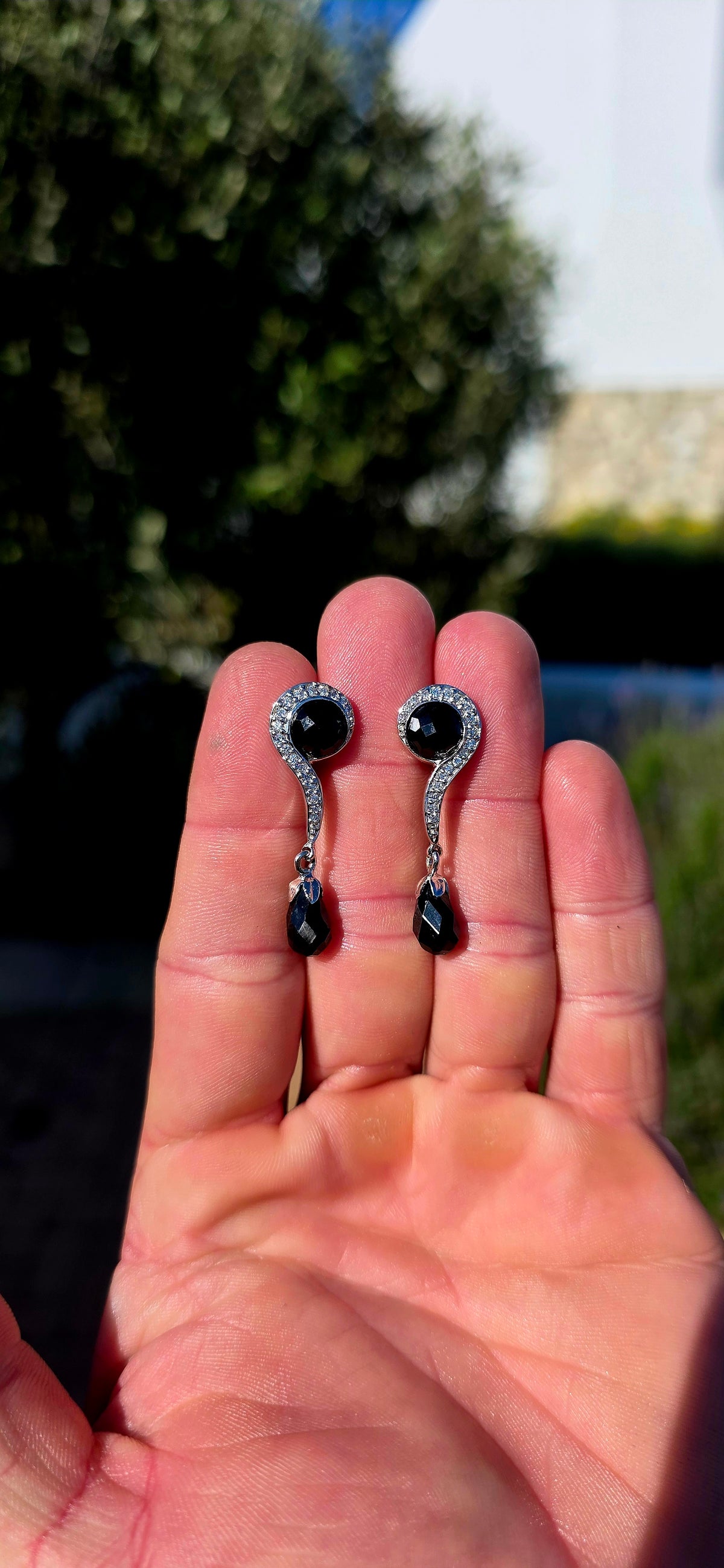 A fabulous pair of Art Deco Revival Sterling Silver drop/dangle earrings, combining glossy jet-black Onyx with sparkling clear CZ gemstones in a wonderfully glamorous 1920s/30s-inspired design.