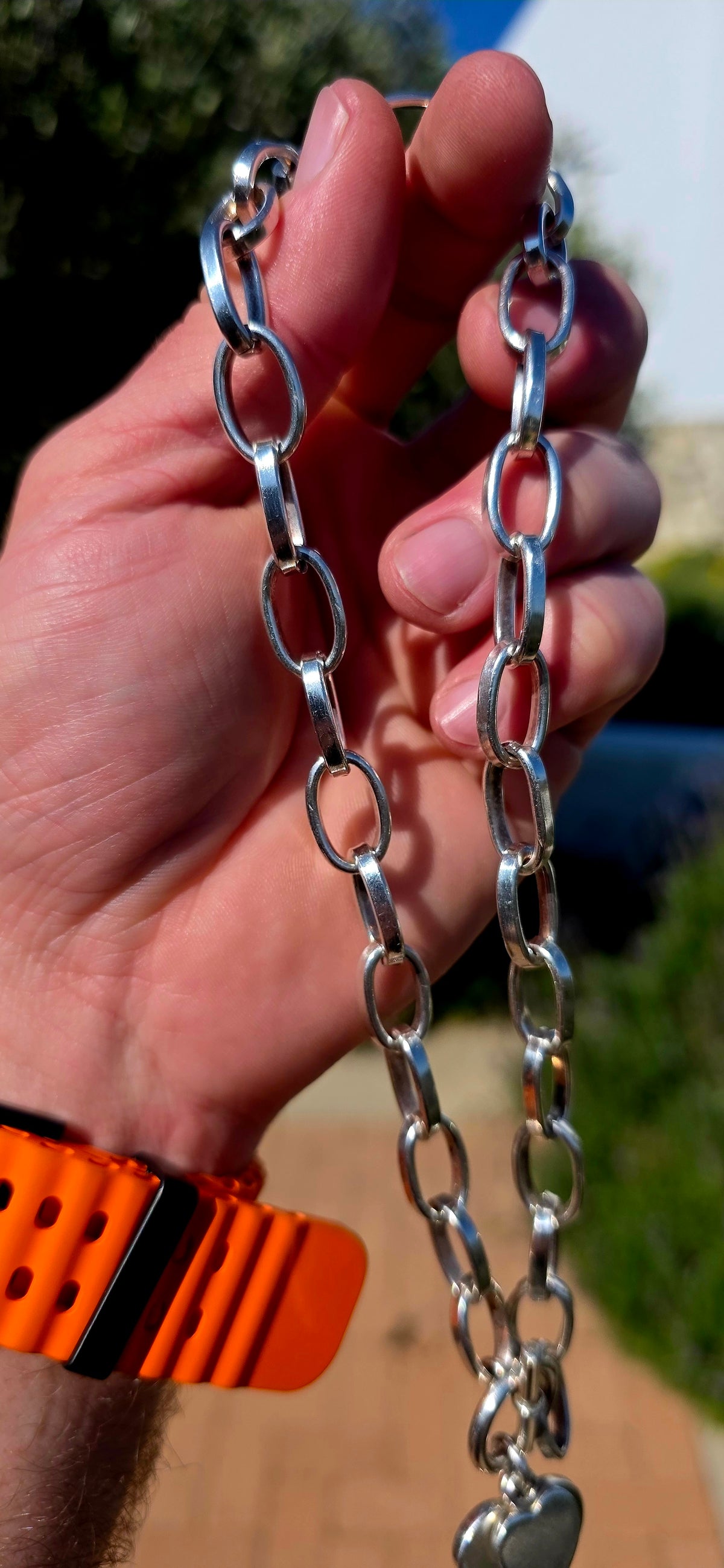 A gorgeous handmade solid Sterling Silver necklace, constructed from substantial alternating elongated oval links with beautifully flattened, almost faceted edges .