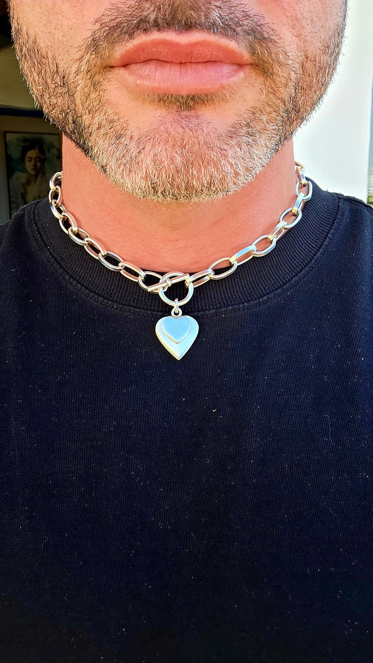 A gorgeous handmade solid Sterling Silver necklace, constructed from substantial alternating elongated oval links with beautifully flattened, almost faceted edges .