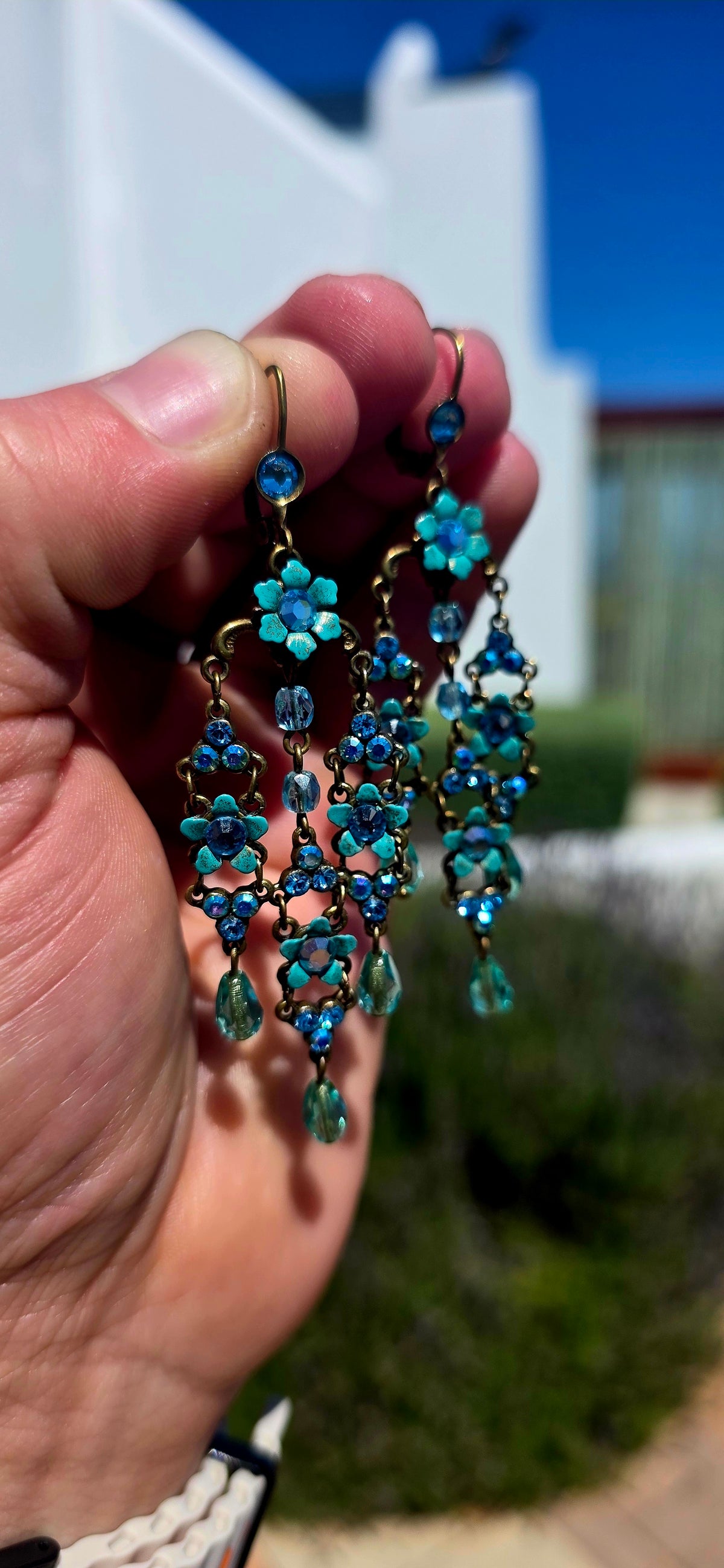 A spectacular pair of vintage designer chandelier earrings by celebrated Israeli jewellery designer Michal Negrin, known for her wonderfully romantic, colourful and unmistakably whimsical creations.