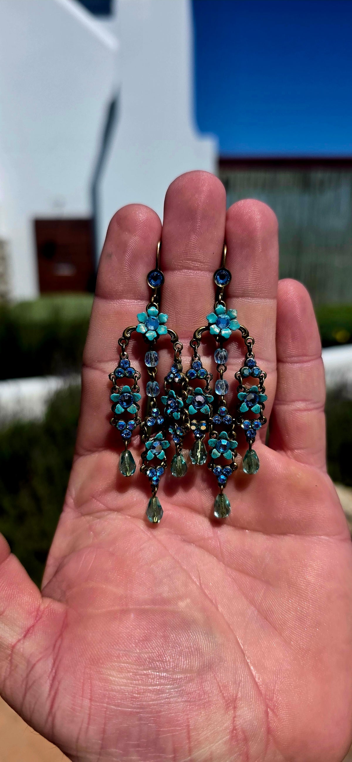 A spectacular pair of vintage designer chandelier earrings by celebrated Israeli jewellery designer Michal Negrin, known for her wonderfully romantic, colourful and unmistakably whimsical creations.