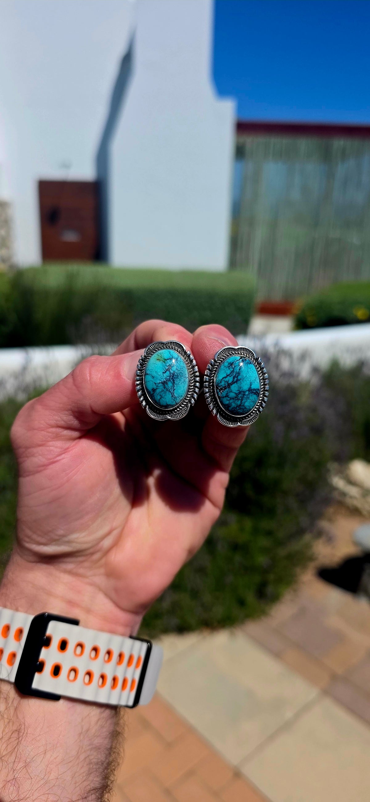 Generously sized pair of vintage Navajo sterling silver and turquoise earrings, handmade and signed by sought-after Navajo silversmith Will Denetdale.