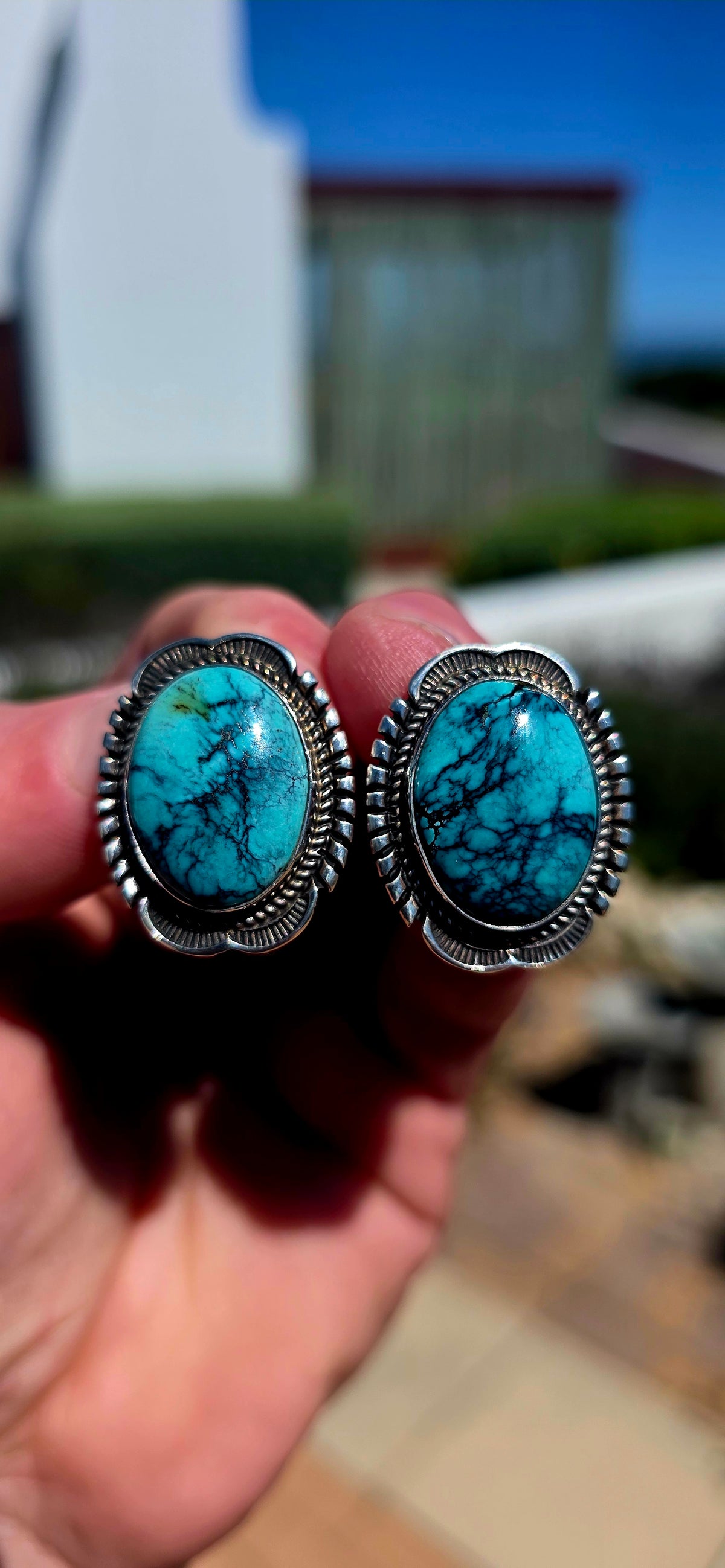 Generously sized pair of vintage Navajo sterling silver and turquoise earrings, handmade and signed by sought-after Navajo silversmith Will Denetdale.