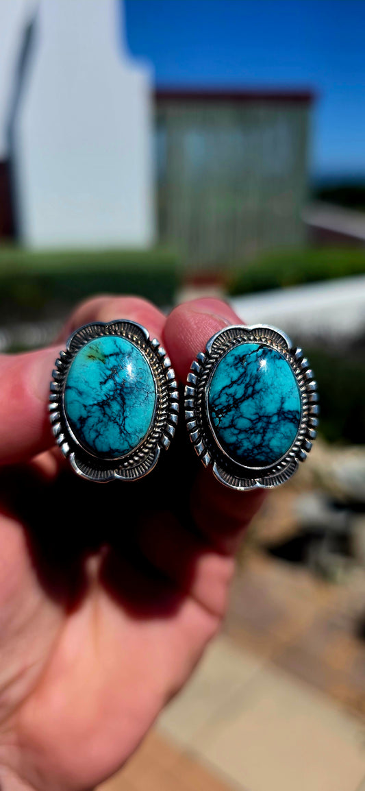 Generously sized pair of vintage Navajo sterling silver and turquoise earrings, handmade and signed by sought-after Navajo silversmith Will Denetdale.
