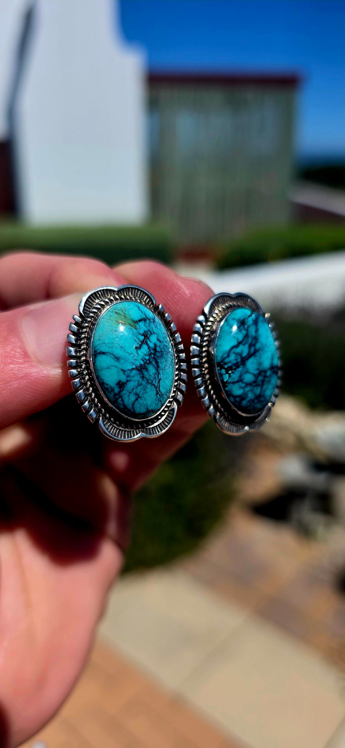 Generously sized pair of vintage Navajo sterling silver and turquoise earrings, handmade and signed by sought-after Navajo silversmith Will Denetdale.