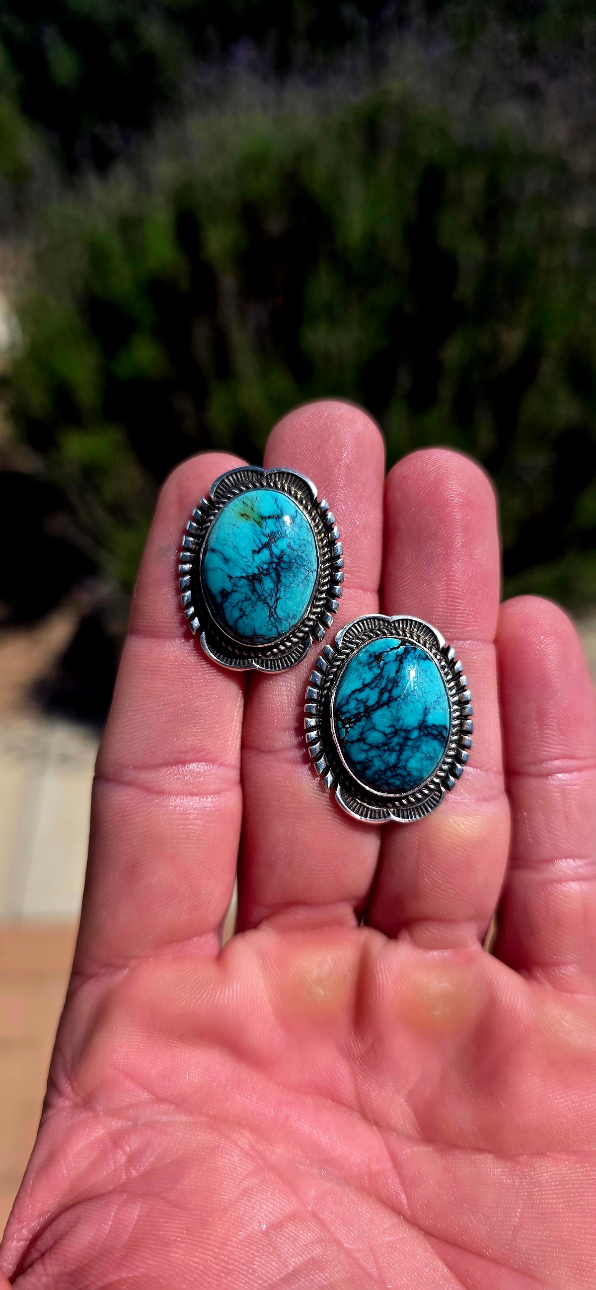 Generously sized pair of vintage Navajo sterling silver and turquoise earrings, handmade and signed by sought-after Navajo silversmith Will Denetdale.