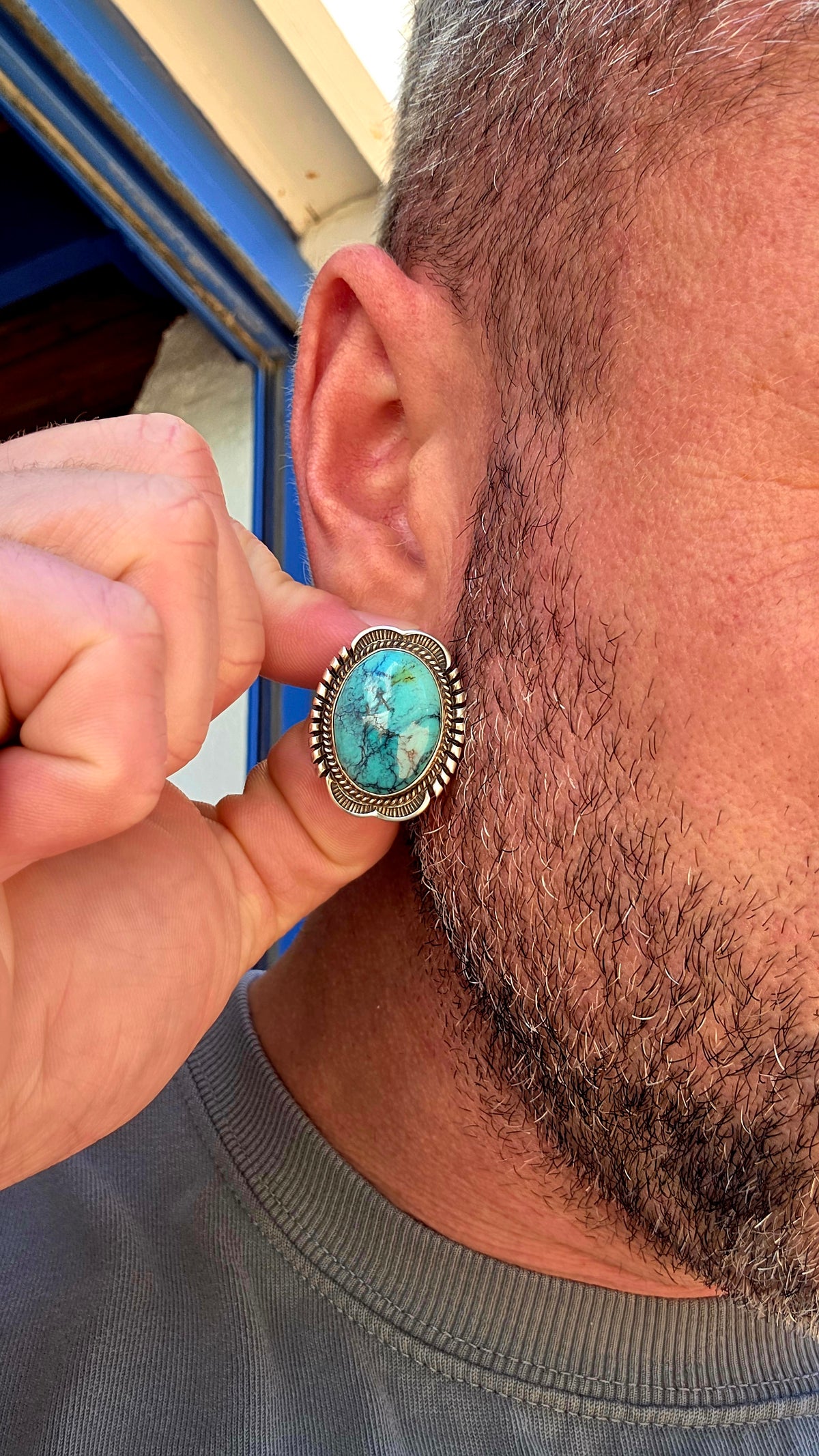 Generously sized pair of vintage Navajo sterling silver and turquoise earrings, handmade and signed by sought-after Navajo silversmith Will Denetdale.