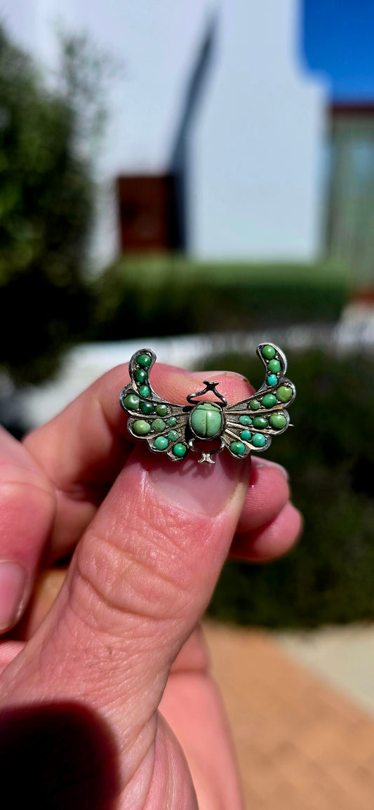An antique late Victorian Egyptian Revival brooch, crafted in sterling silver and designed as a magnificent winged scarab.