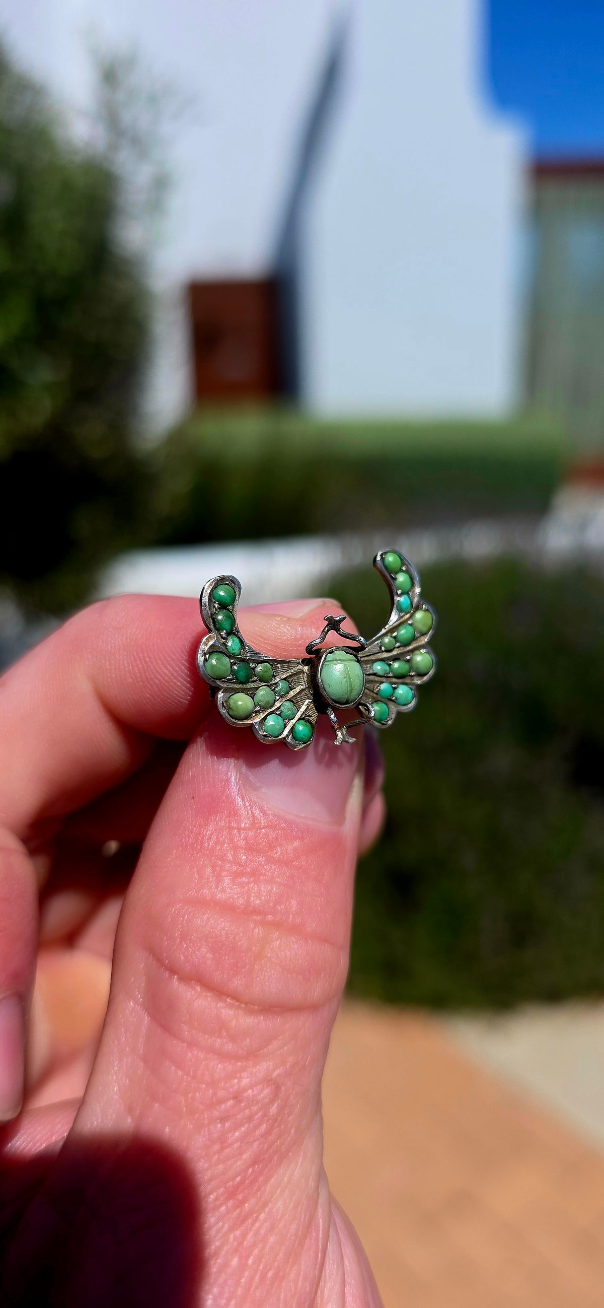 An antique late Victorian Egyptian Revival brooch, crafted in sterling silver and designed as a magnificent winged scarab.