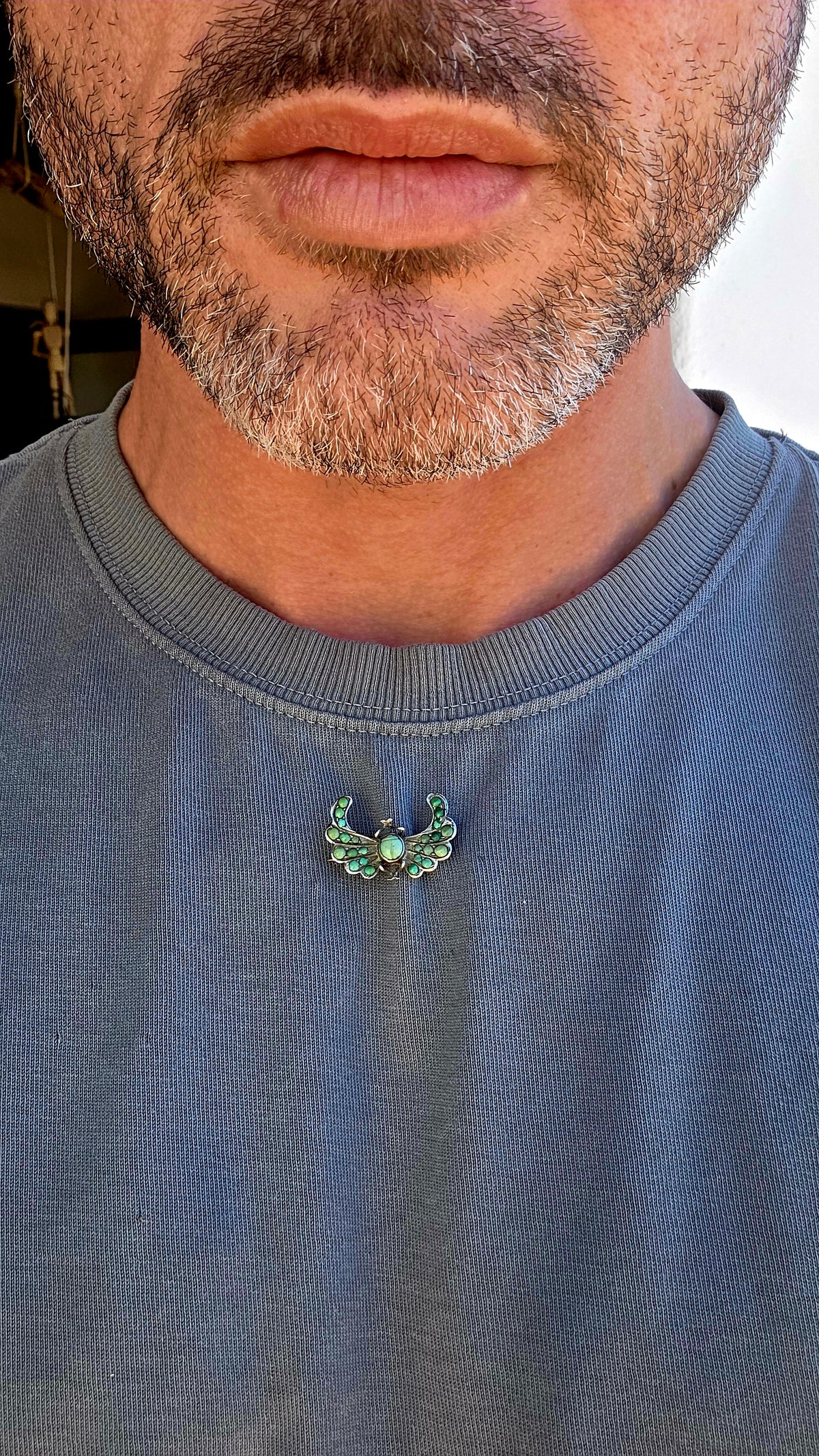 An antique late Victorian Egyptian Revival brooch, crafted in sterling silver and designed as a magnificent winged scarab.