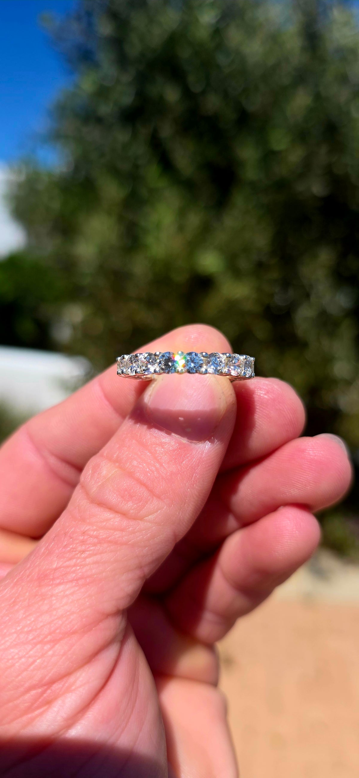 A fabulous sterling silver full eternity stacking ring, completely encircled by 19 ultra-sparkly round-cut AAA Swiss-grade CZ gemstones.