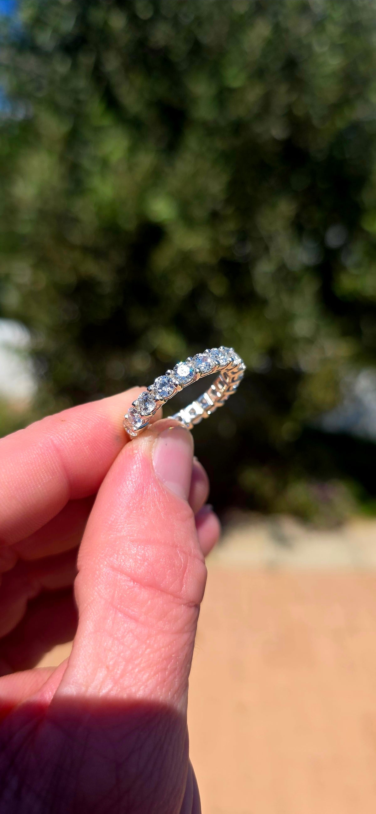 A fabulous sterling silver full eternity stacking ring, completely encircled by 19 ultra-sparkly round-cut AAA Swiss-grade CZ gemstones.