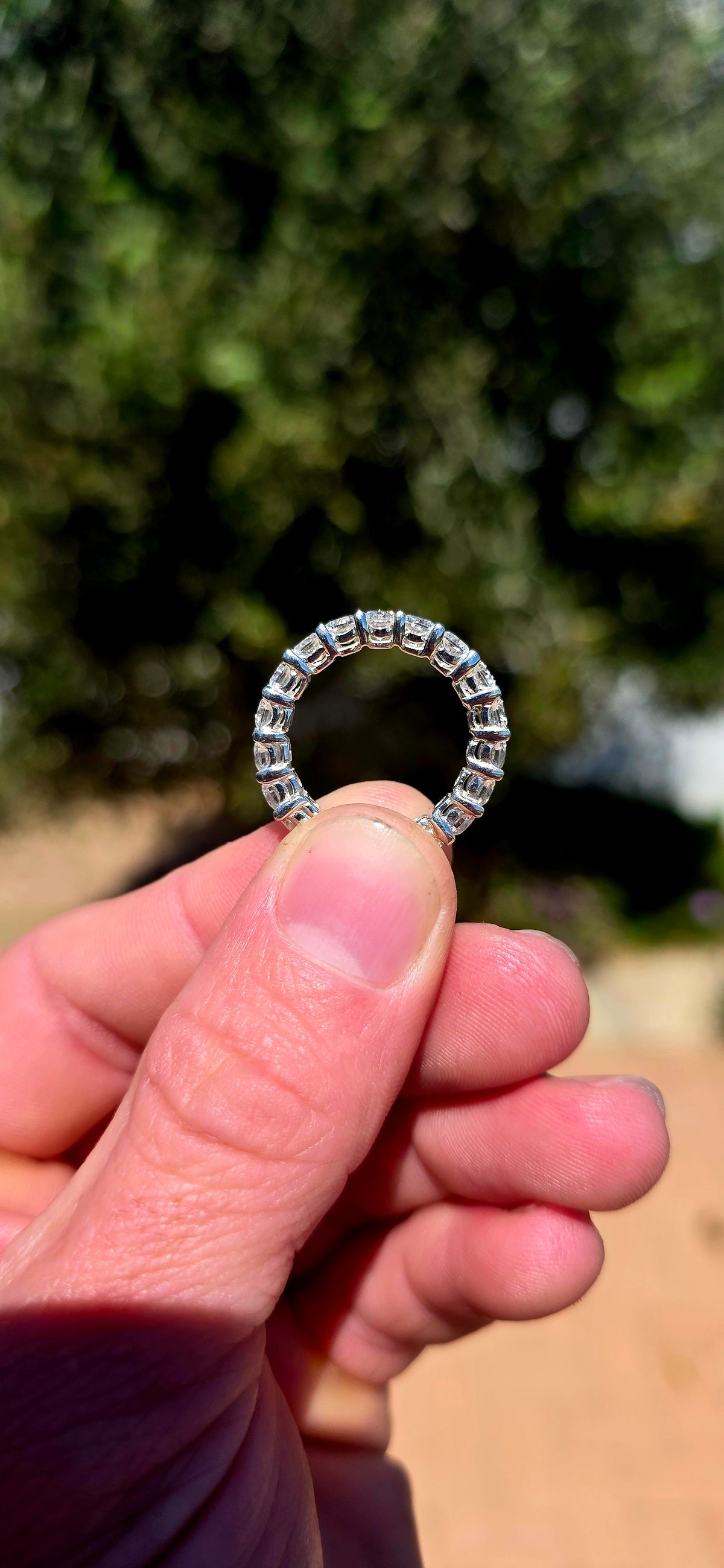 A fabulous sterling silver full eternity stacking ring, completely encircled by 19 ultra-sparkly round-cut AAA Swiss-grade CZ gemstones.