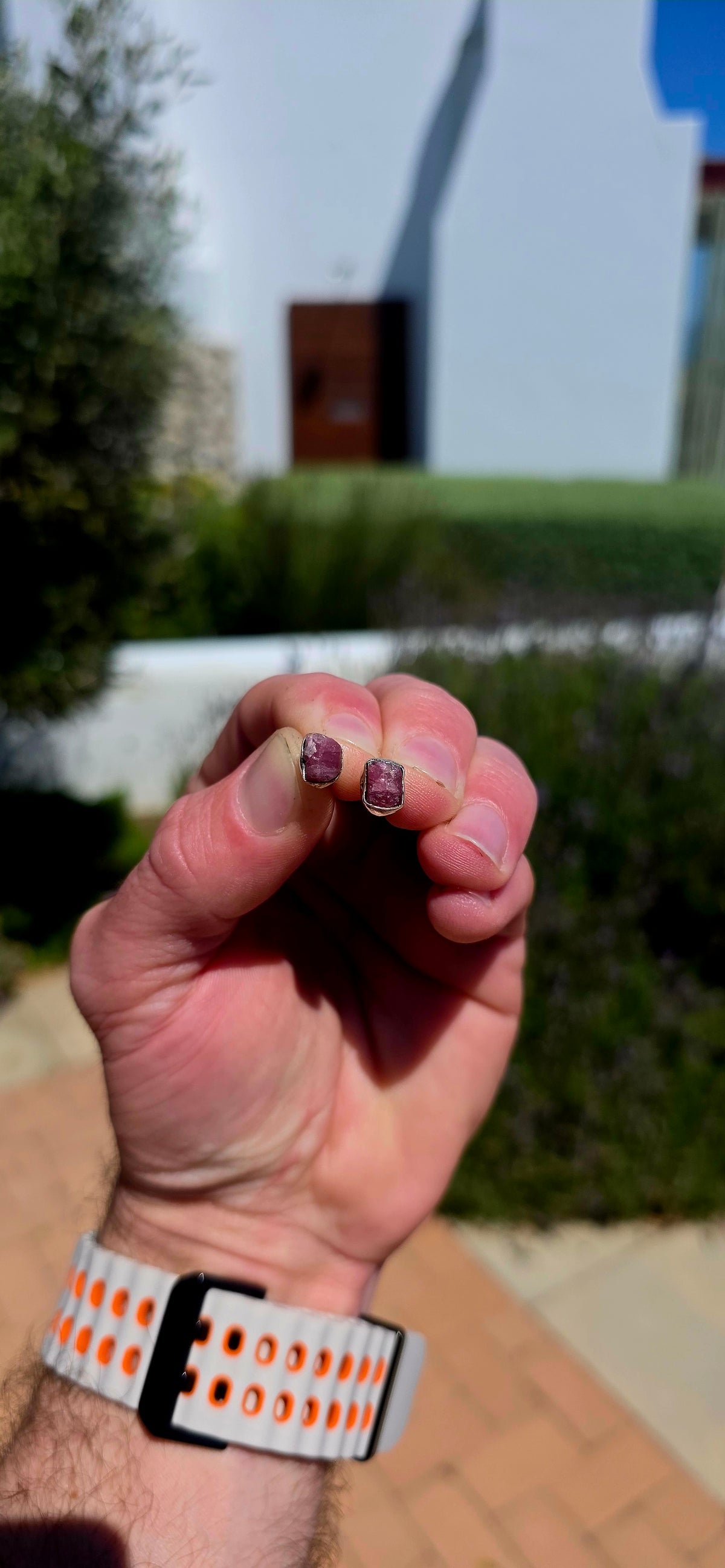 These artisan sterling silver stud earrings are each adorned with a beautifully raw, uncut pink tourmaline gemstone, celebrating the stone exactly as nature created it.