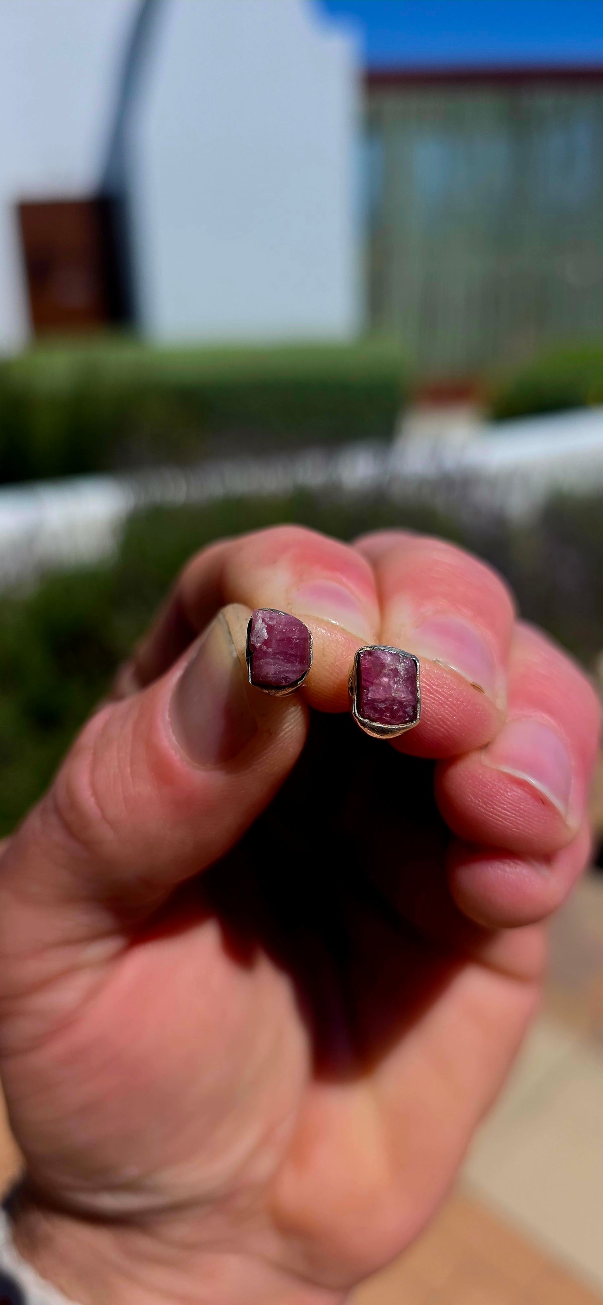 These artisan sterling silver stud earrings are each adorned with a beautifully raw, uncut pink tourmaline gemstone, celebrating the stone exactly as nature created it.