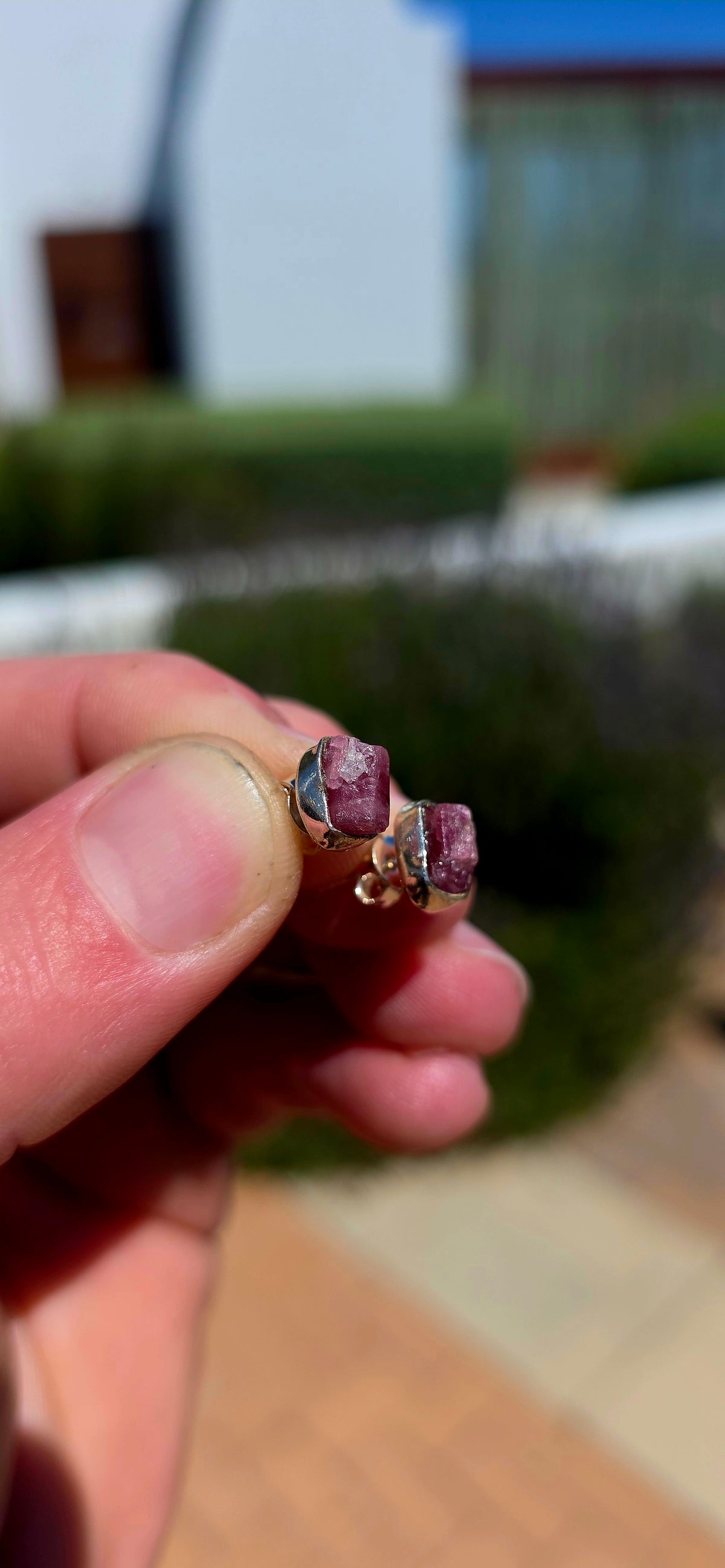 These artisan sterling silver stud earrings are each adorned with a beautifully raw, uncut pink tourmaline gemstone, celebrating the stone exactly as nature created it.
