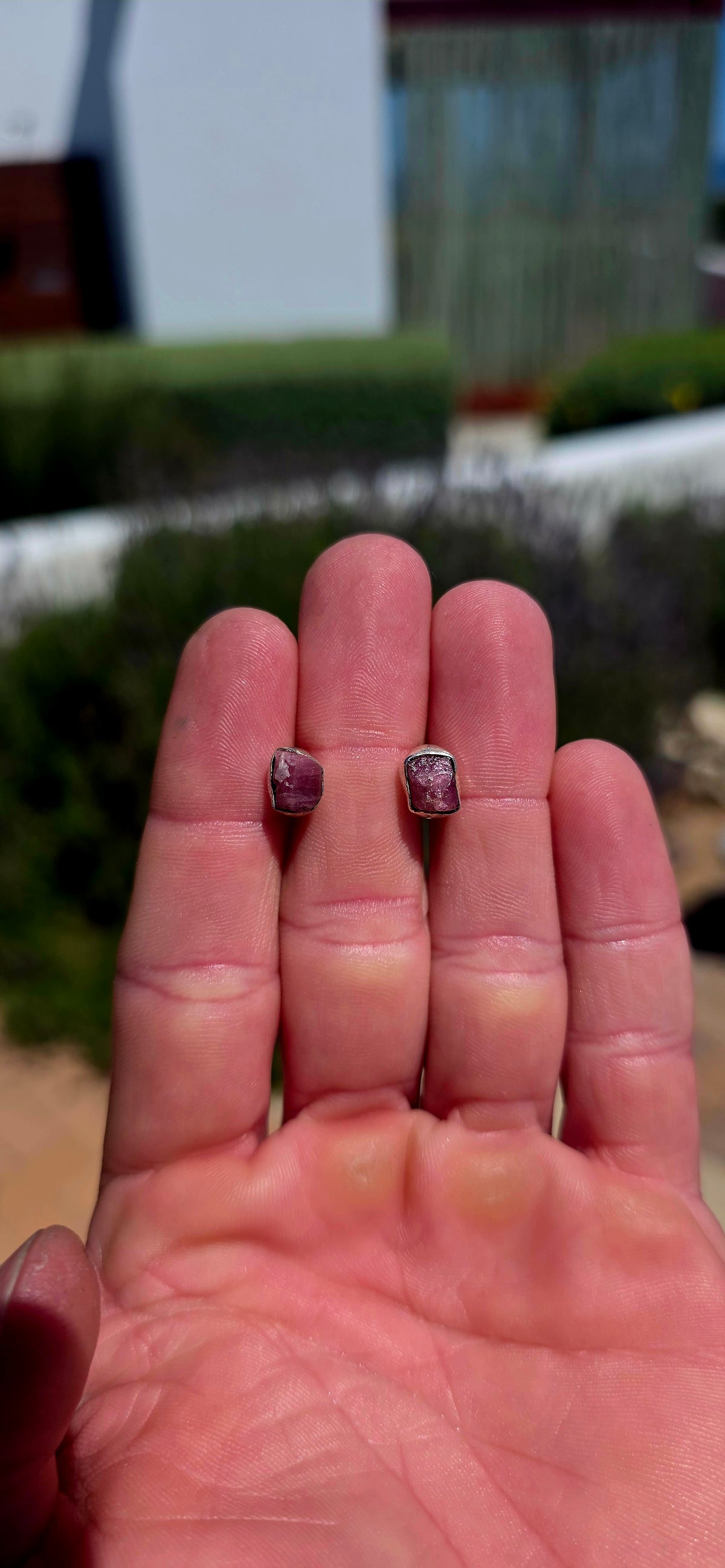 These artisan sterling silver stud earrings are each adorned with a beautifully raw, uncut pink tourmaline gemstone, celebrating the stone exactly as nature created it.