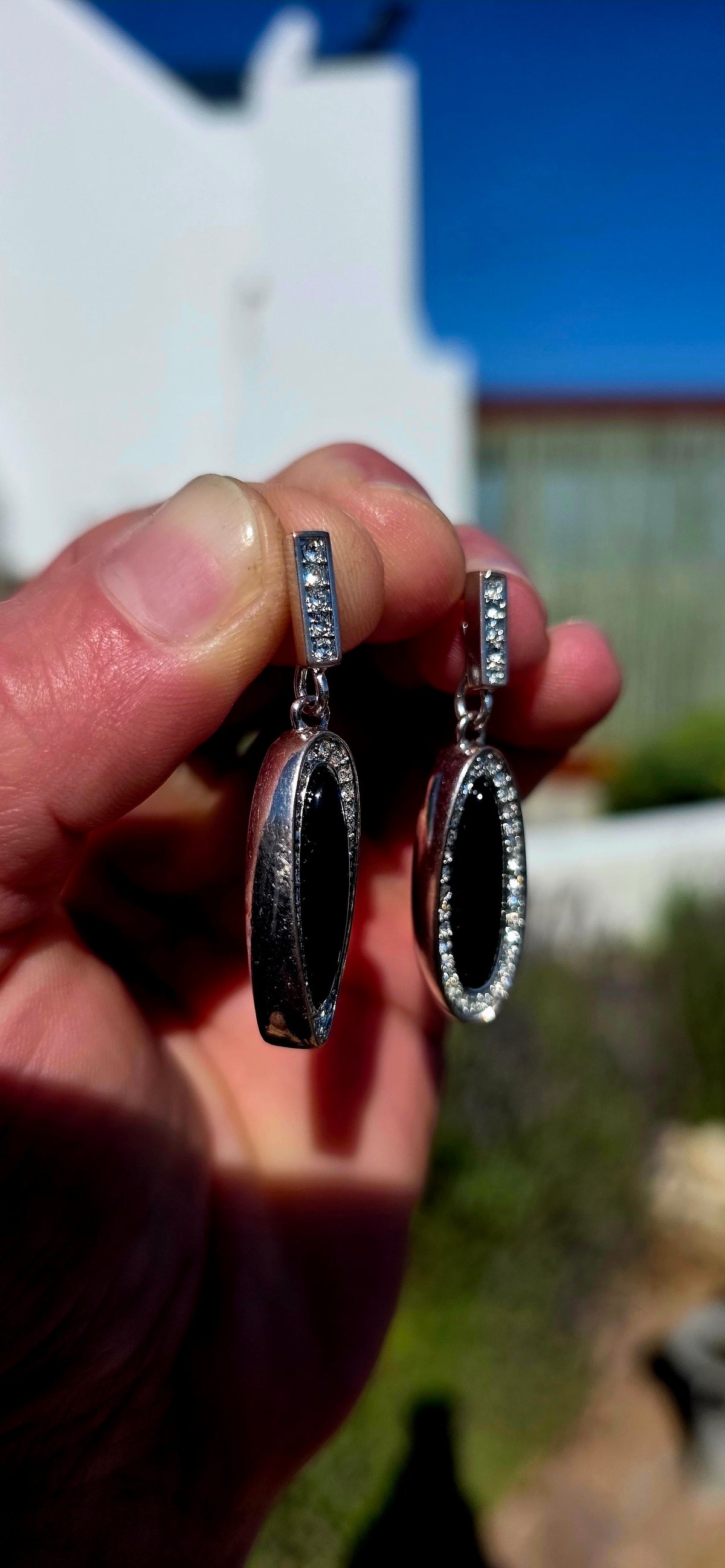 Beautifully crafted in sterling silver in a glamorous Art Deco Revival style, these high-end drop earrings have a rather clever secret — they are completely reversible!