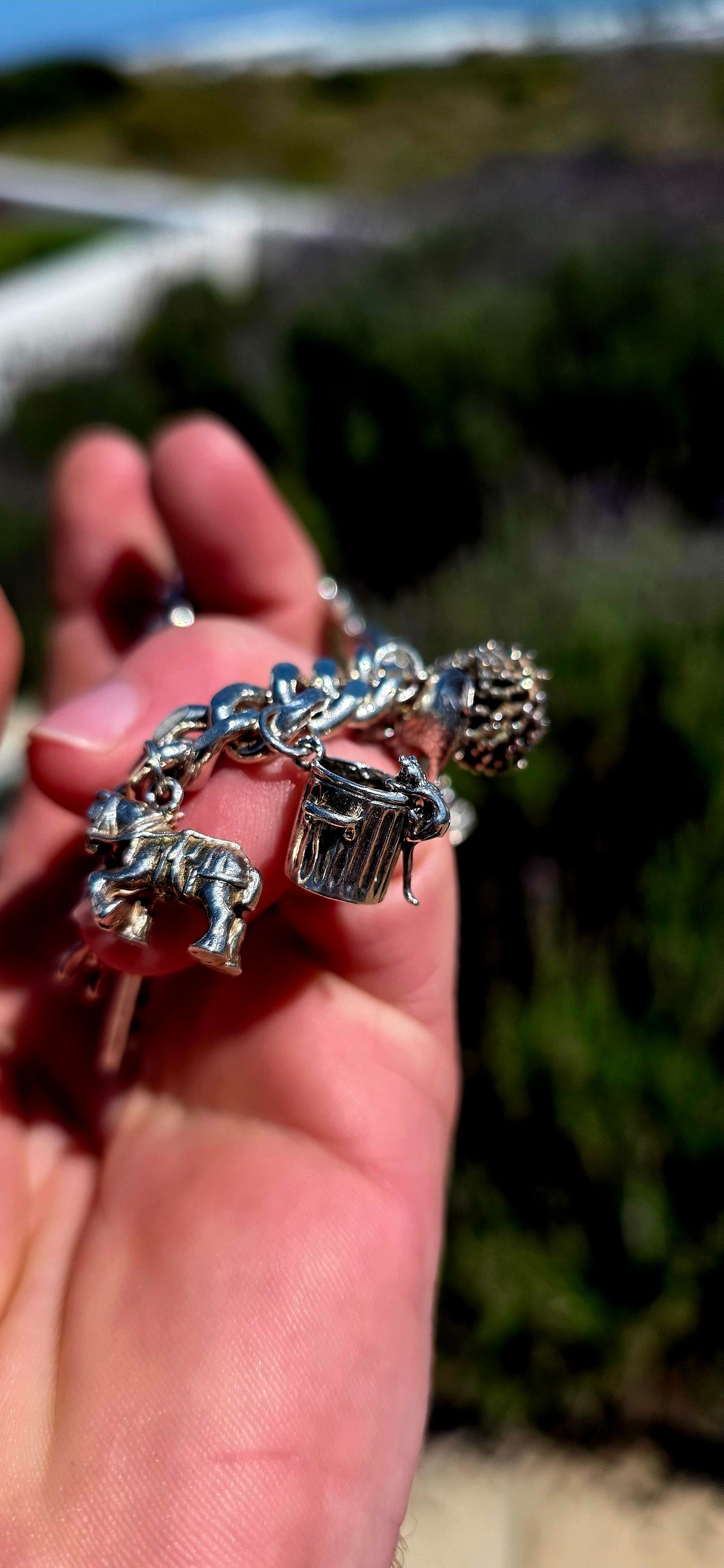 Now THIS is a proper old-school charm bracelet!! A marvellous vintage piece crafted around a beautifully substantial solid sterling silver curb-link bracelet, absolutely loaded with 13 individual sterling silver charms.