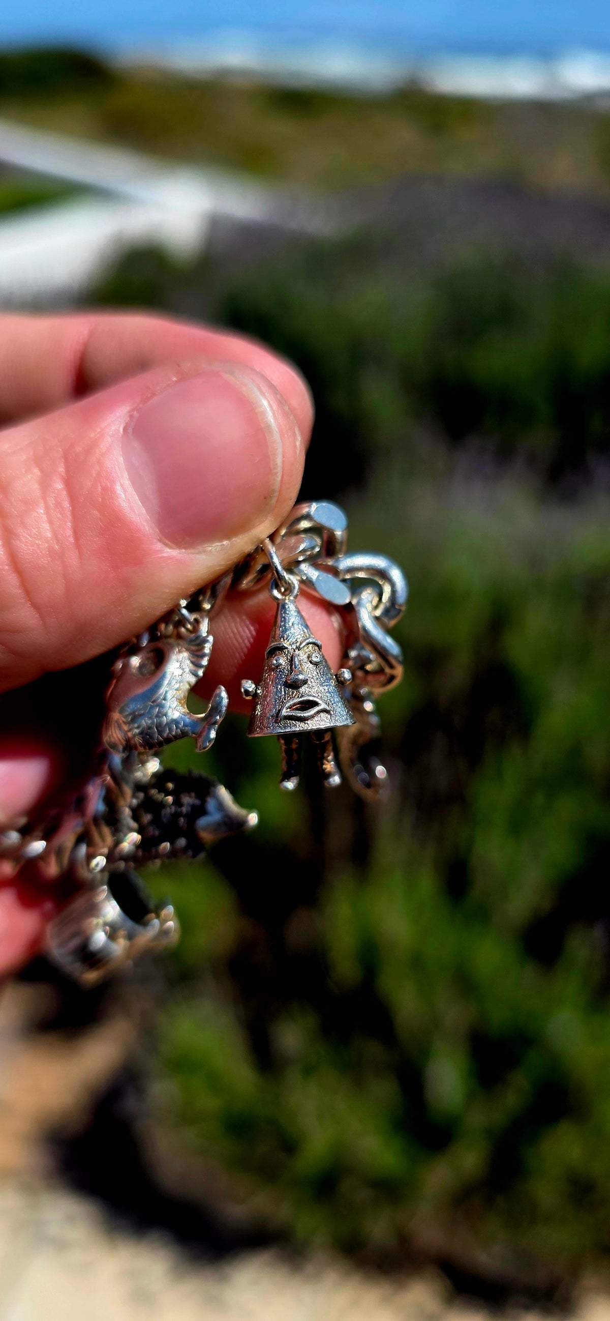 Now THIS is a proper old-school charm bracelet!! A marvellous vintage piece crafted around a beautifully substantial solid sterling silver curb-link bracelet, absolutely loaded with 13 individual sterling silver charms.