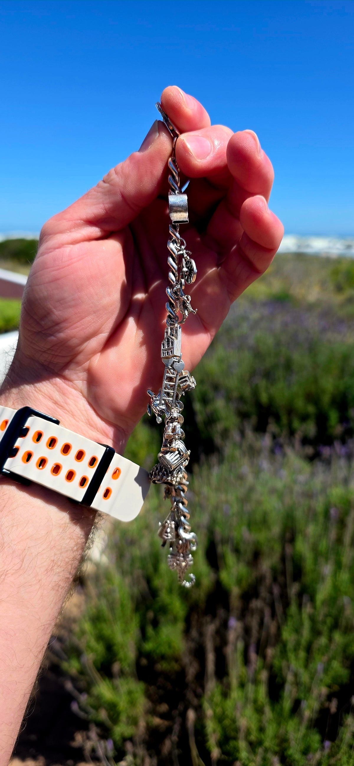 Now THIS is a proper old-school charm bracelet!! A marvellous vintage piece crafted around a beautifully substantial solid sterling silver curb-link bracelet, absolutely loaded with 13 individual sterling silver charms.