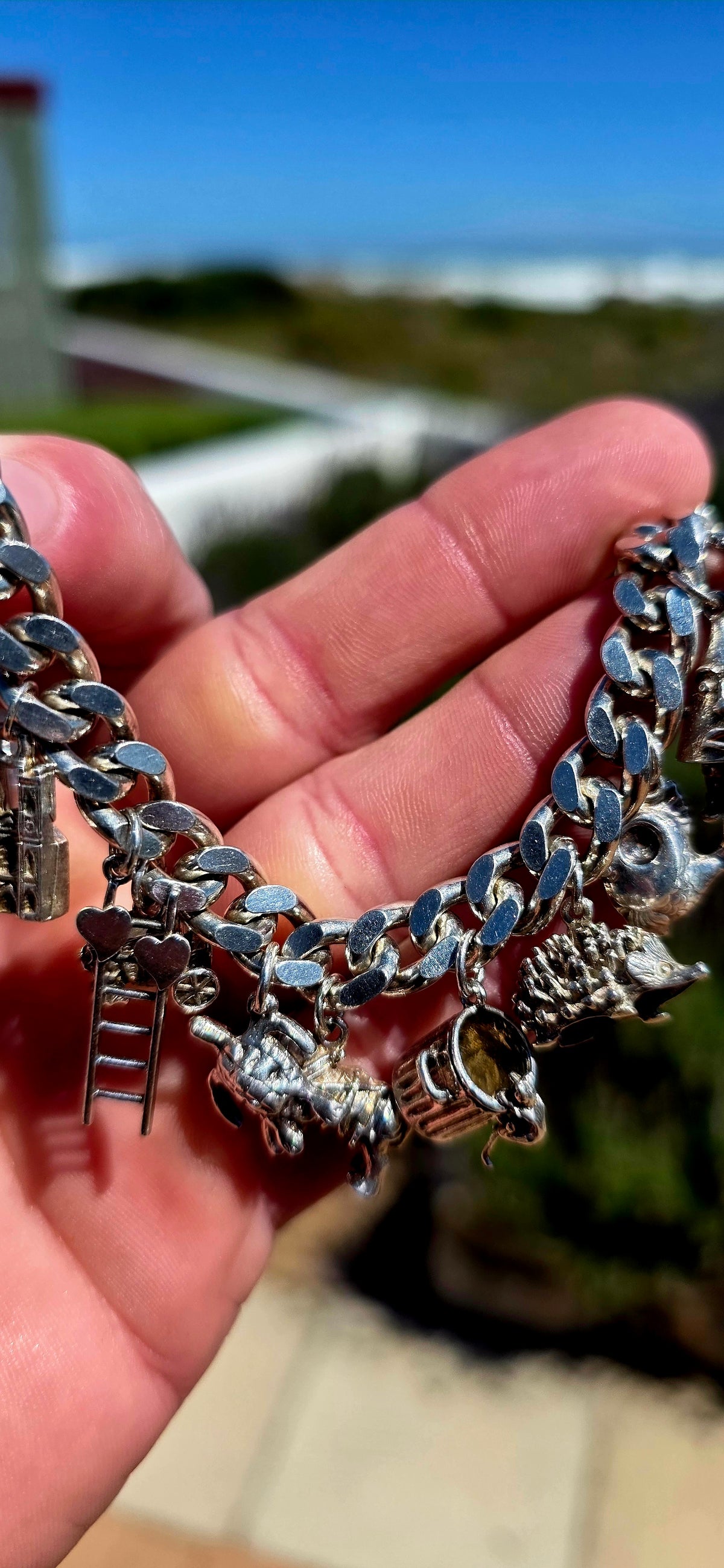 Now THIS is a proper old-school charm bracelet!! A marvellous vintage piece crafted around a beautifully substantial solid sterling silver curb-link bracelet, absolutely loaded with 13 individual sterling silver charms.