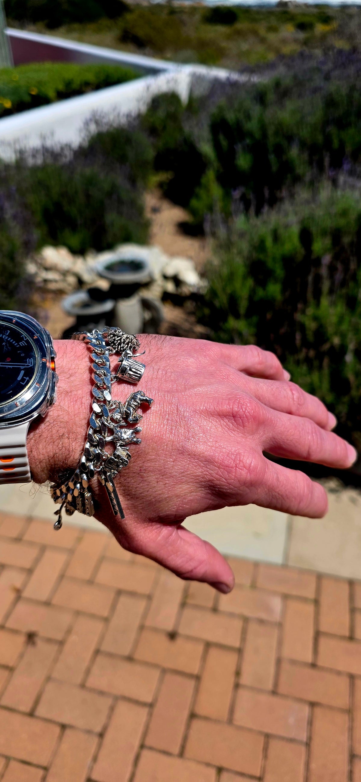 Now THIS is a proper old-school charm bracelet!! A marvellous vintage piece crafted around a beautifully substantial solid sterling silver curb-link bracelet, absolutely loaded with 13 individual sterling silver charms.