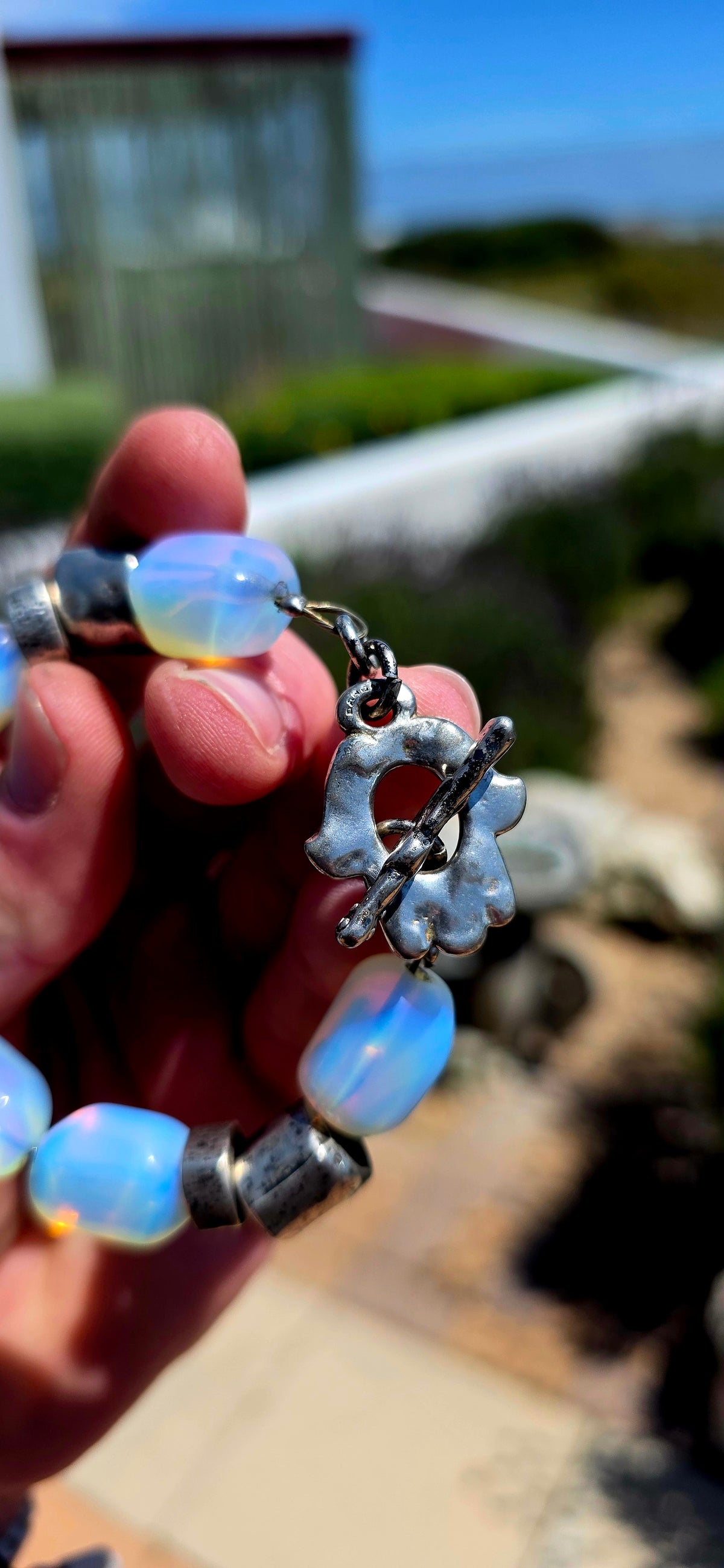A fabulous chunky vintage designer costume bracelet by Israeli jewellery house DANON, combining sculptural silver-plated metalwork with dreamy, luminous opalite glass beads!
