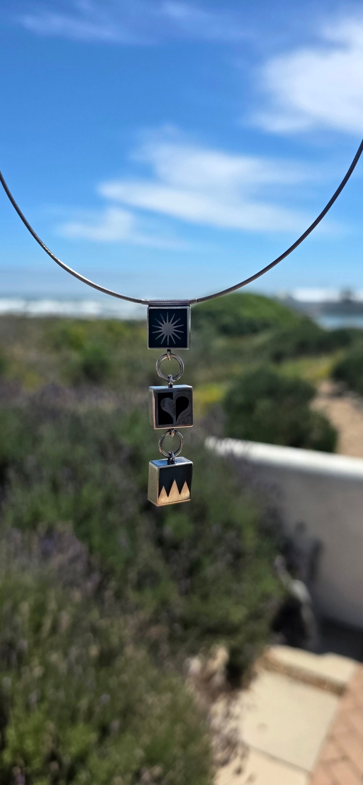 A wonderfully artistic and contemporary statement necklace by jewellery designer Victoria Varga, combining bold geometric shapes, beautiful symbolism and striking colour!