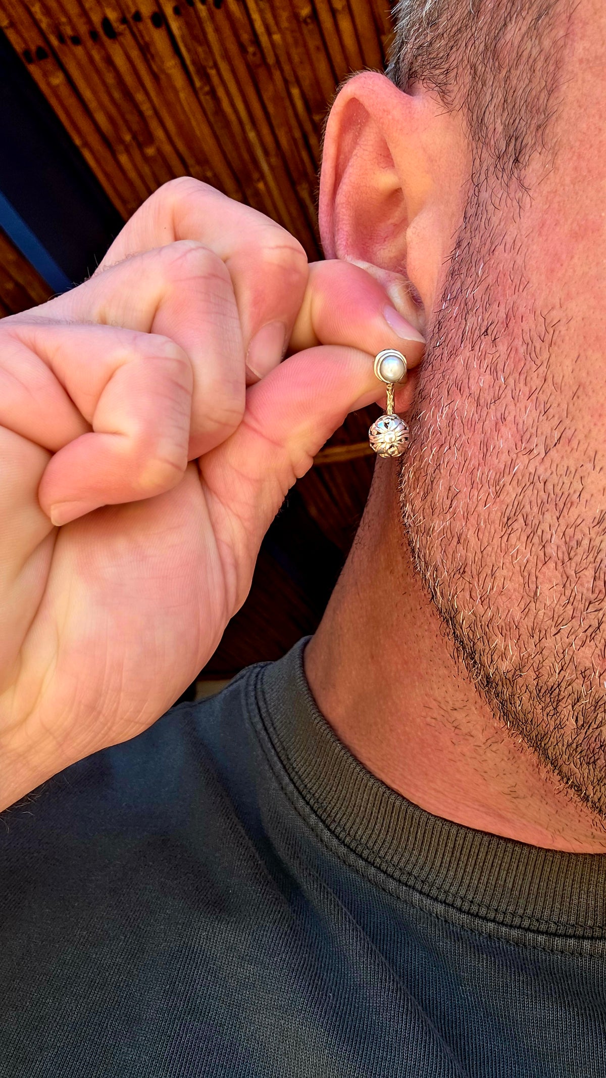 A wonderfully versatile pair of sterling silver earrings combining classical pearl elegance with beautifully detailed silver craftsmanship!