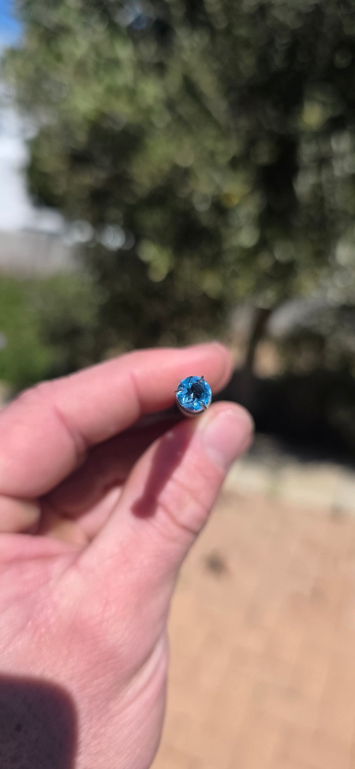 A beautiful matching pair of unset round-cut Sky Blue Topaz gemstones, displaying the most delicate, crystal-clear icy blue colour!