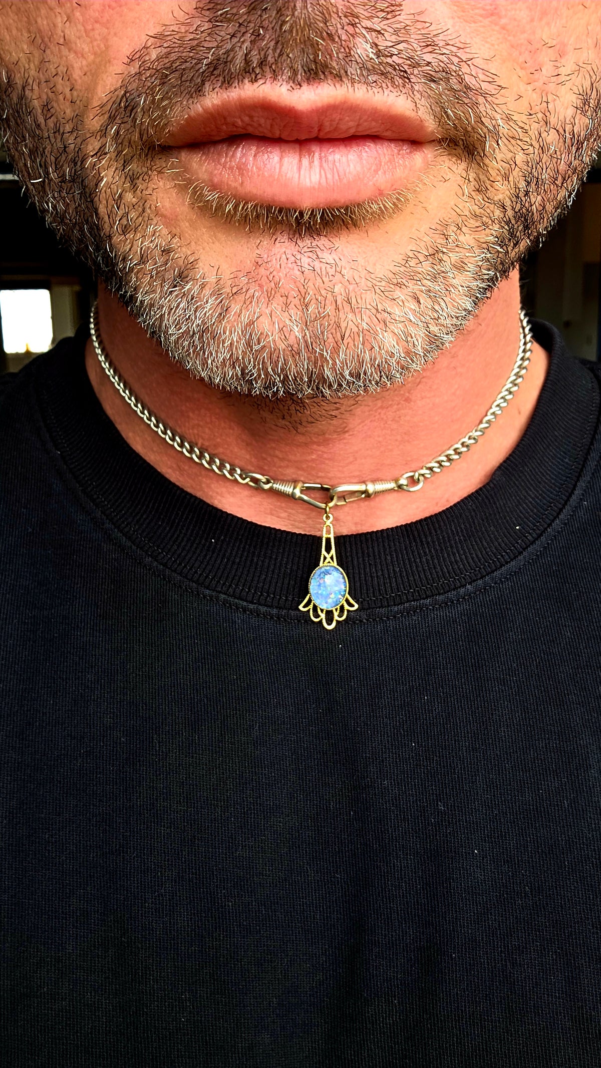 A gorgeous vintage yellow gold-plated pendant featuring a mesmerising oval opal triplet cabochon, beautifully bezel-set at its centre.