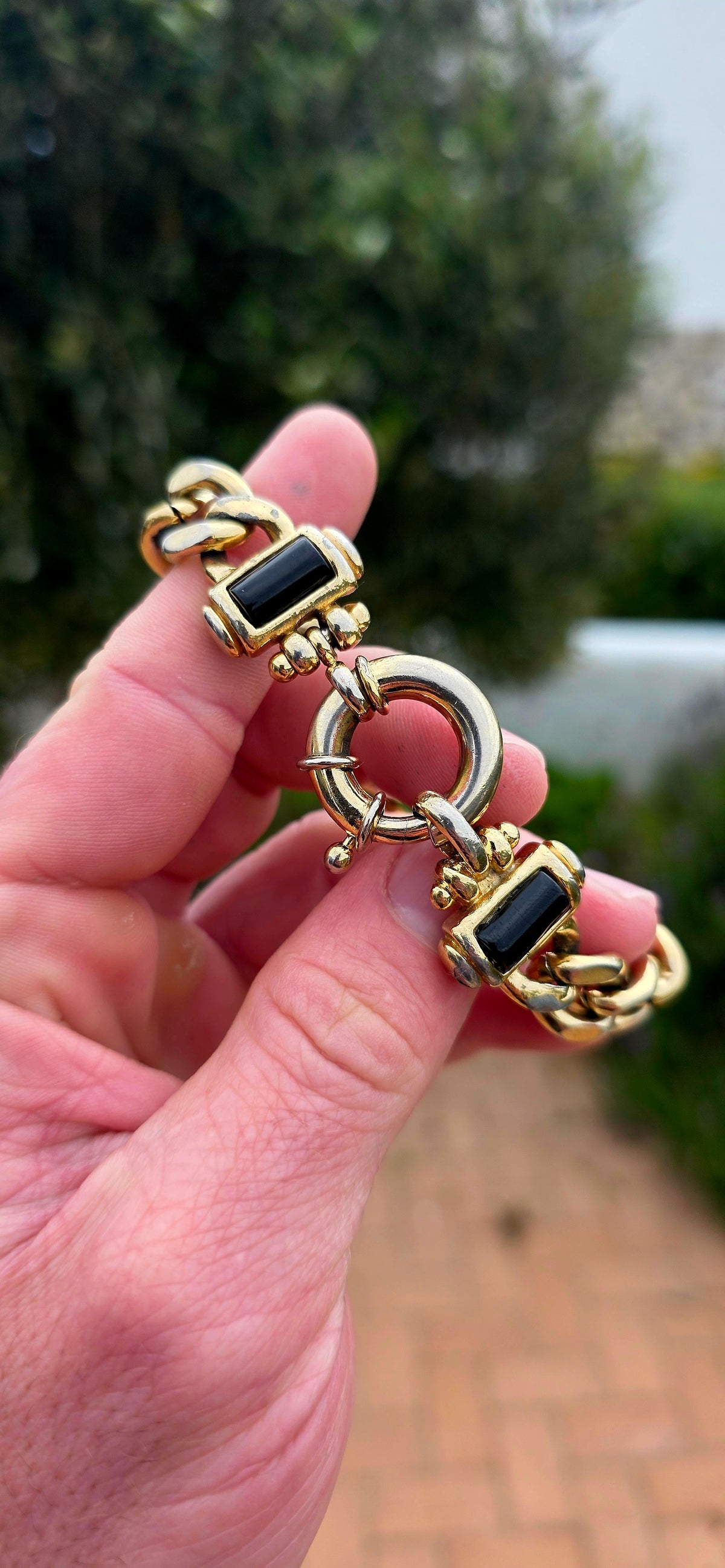 A fabulous vintage 1990s chunky costume bracelet crafted in rich yellow gold plating, featuring oversized, beautifully polished curb links that create a bold, luxurious statement on the wrist!
