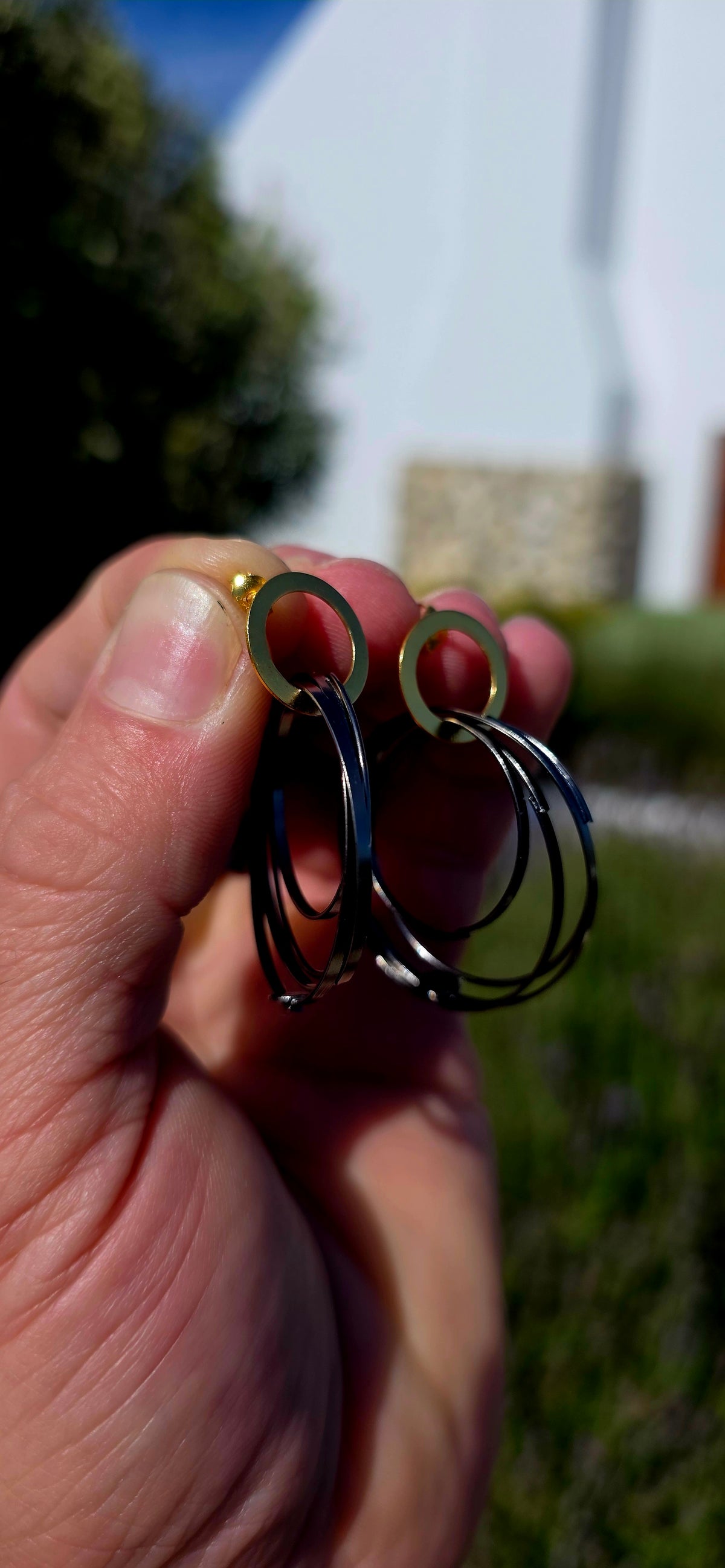 A generously sized pair of artisan-made sterling silver statement earrings, combining bold geometric design with a fabulous contrast of gold and oxidised black silver!