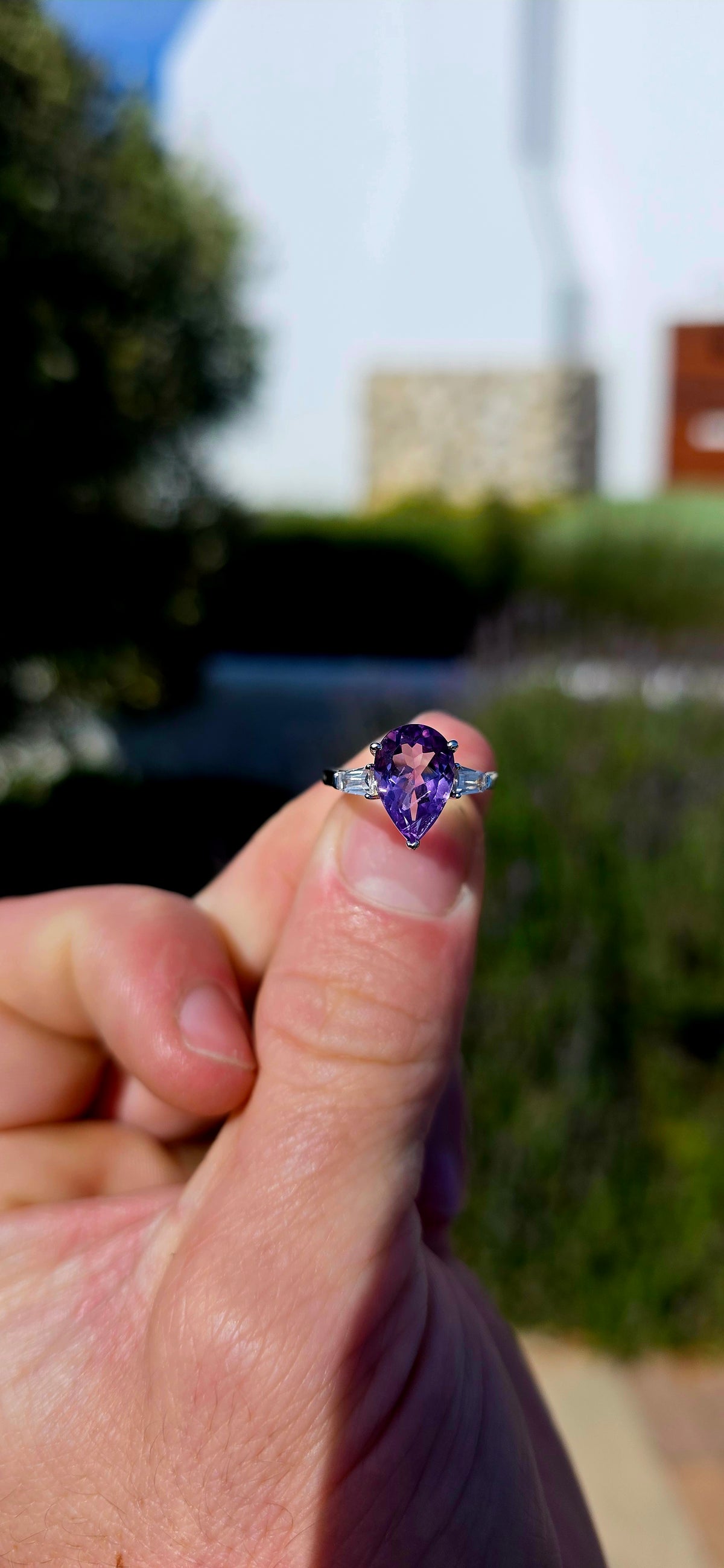 A gorgeous sterling silver trilogy ring, beautifully designed in an Art Deco revival style with a fabulous splash of purple!