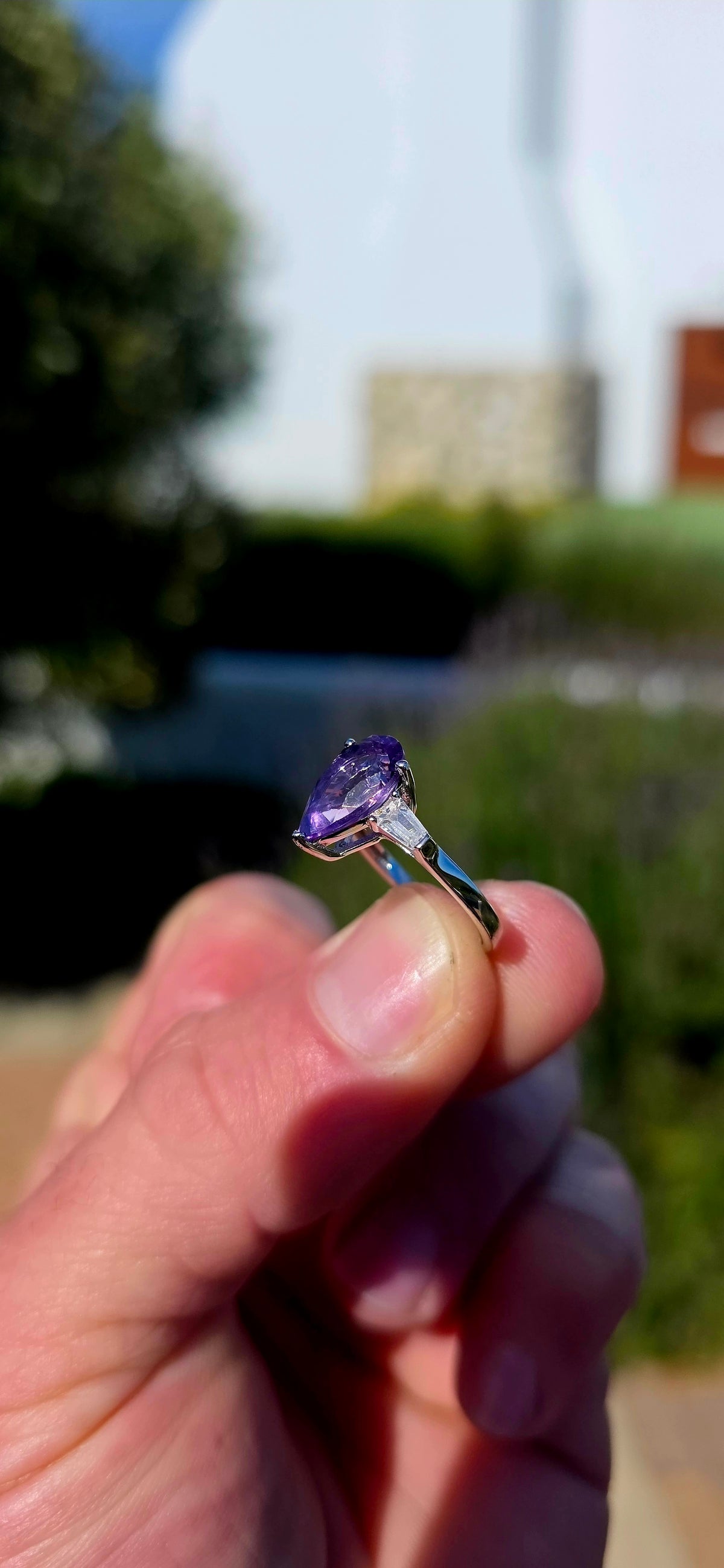 A gorgeous sterling silver trilogy ring, beautifully designed in an Art Deco revival style with a fabulous splash of purple!