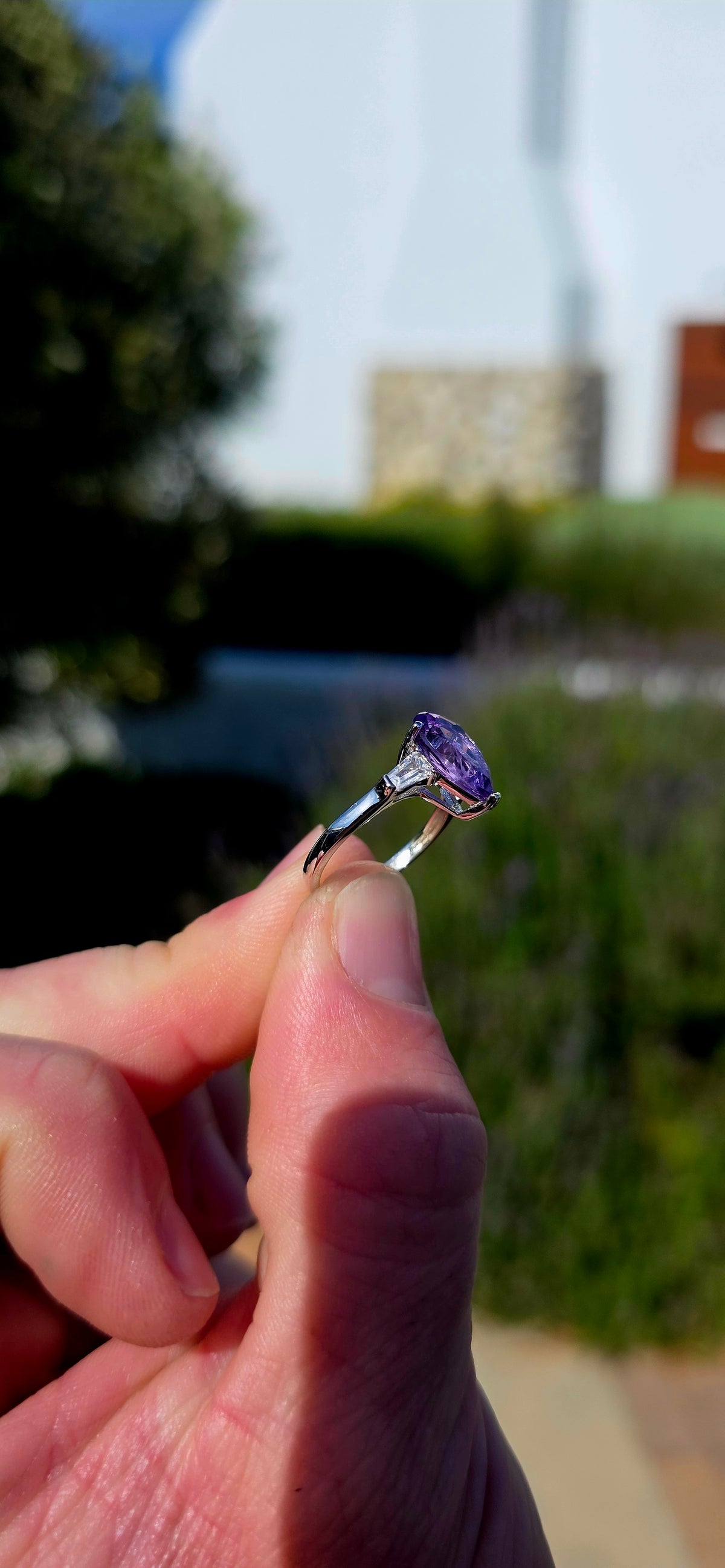 A gorgeous sterling silver trilogy ring, beautifully designed in an Art Deco revival style with a fabulous splash of purple!
