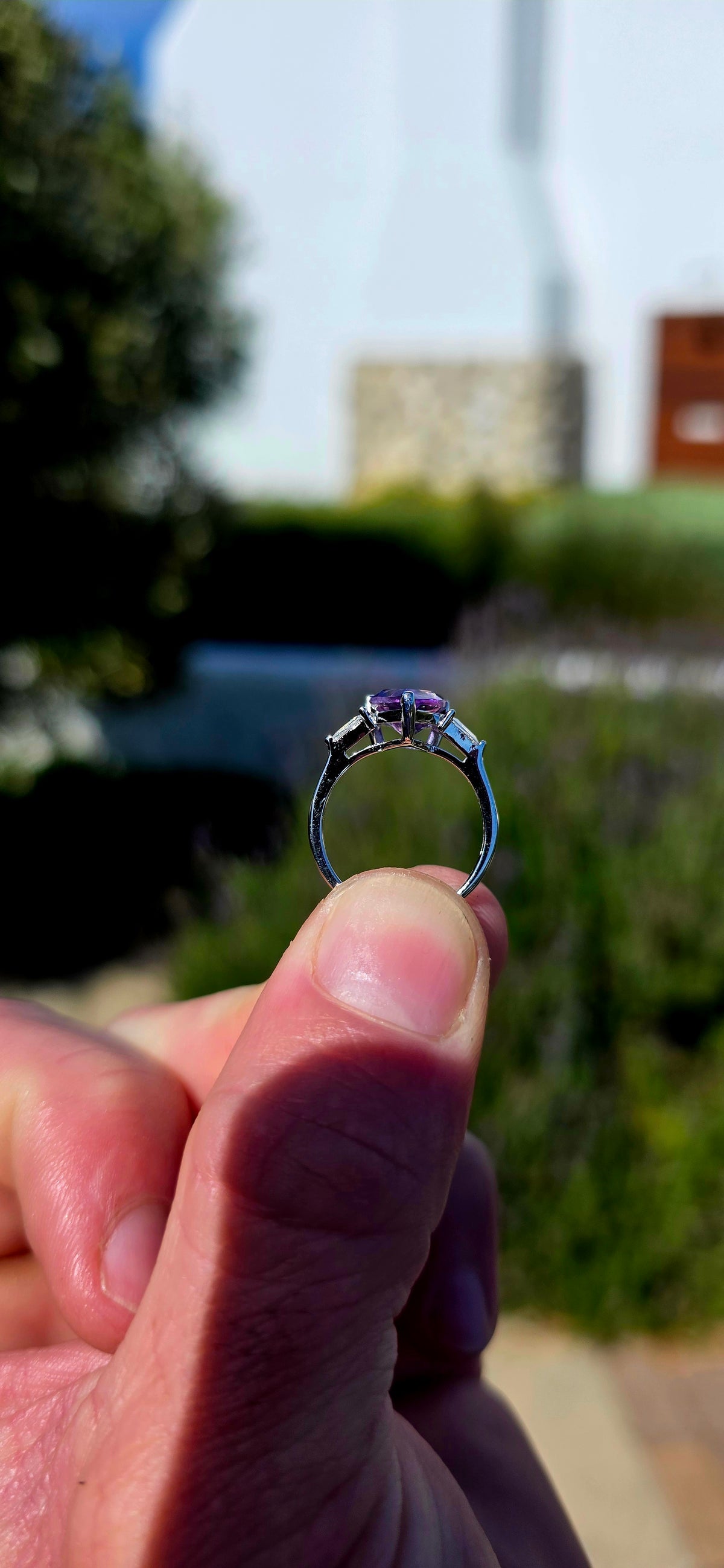 A gorgeous sterling silver trilogy ring, beautifully designed in an Art Deco revival style with a fabulous splash of purple!