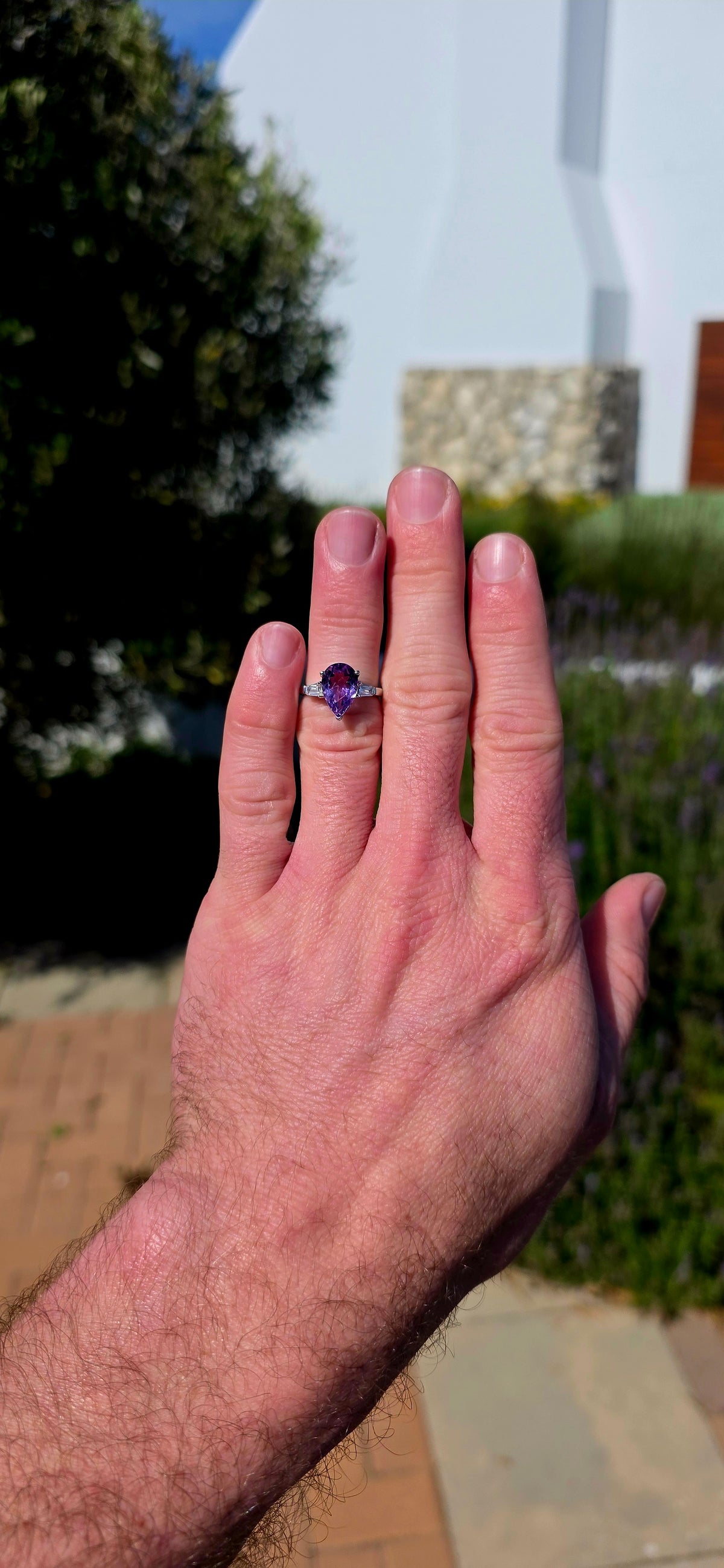 A gorgeous sterling silver trilogy ring, beautifully designed in an Art Deco revival style with a fabulous splash of purple!
