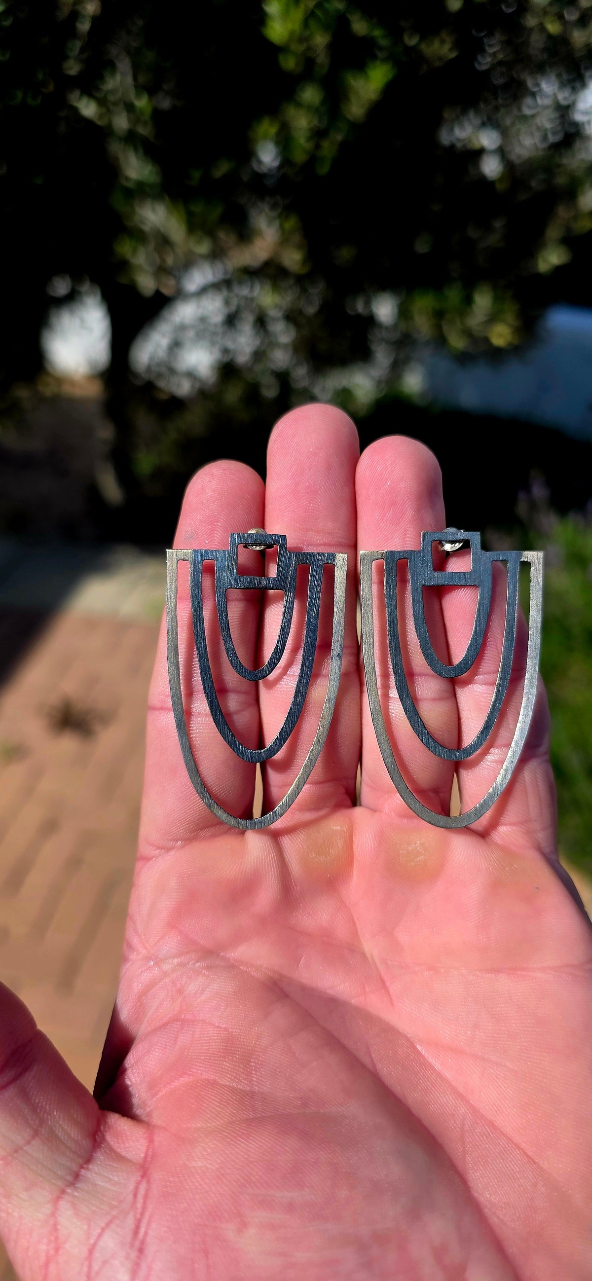 An absolutely striking pair of generously sized, artisan-crafted sterling silver statement earrings, designed in a wonderfully bold Art Deco revival style!