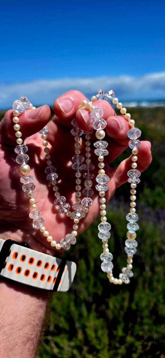 A beautifully delicate, extra-long necklace combining the elegance of Akoya marine cultured pearls with the ethereal sparkle of antique hand-faceted aquamarine gemstones!
