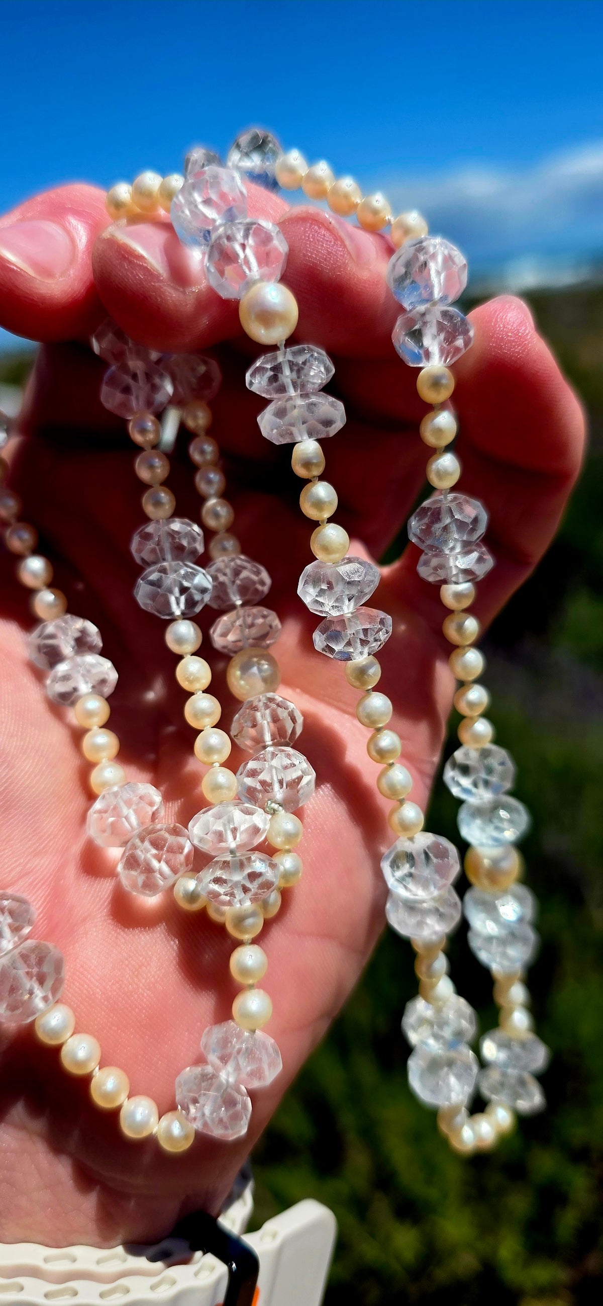 A beautifully delicate, extra-long necklace combining the elegance of Akoya marine cultured pearls with the ethereal sparkle of antique hand-faceted aquamarine gemstones!