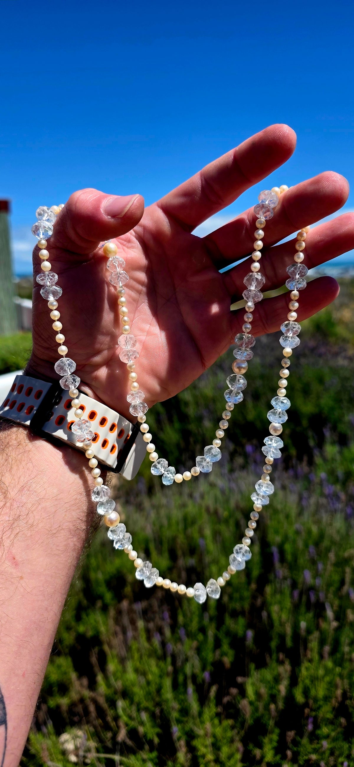 A beautifully delicate, extra-long necklace combining the elegance of Akoya marine cultured pearls with the ethereal sparkle of antique hand-faceted aquamarine gemstones!