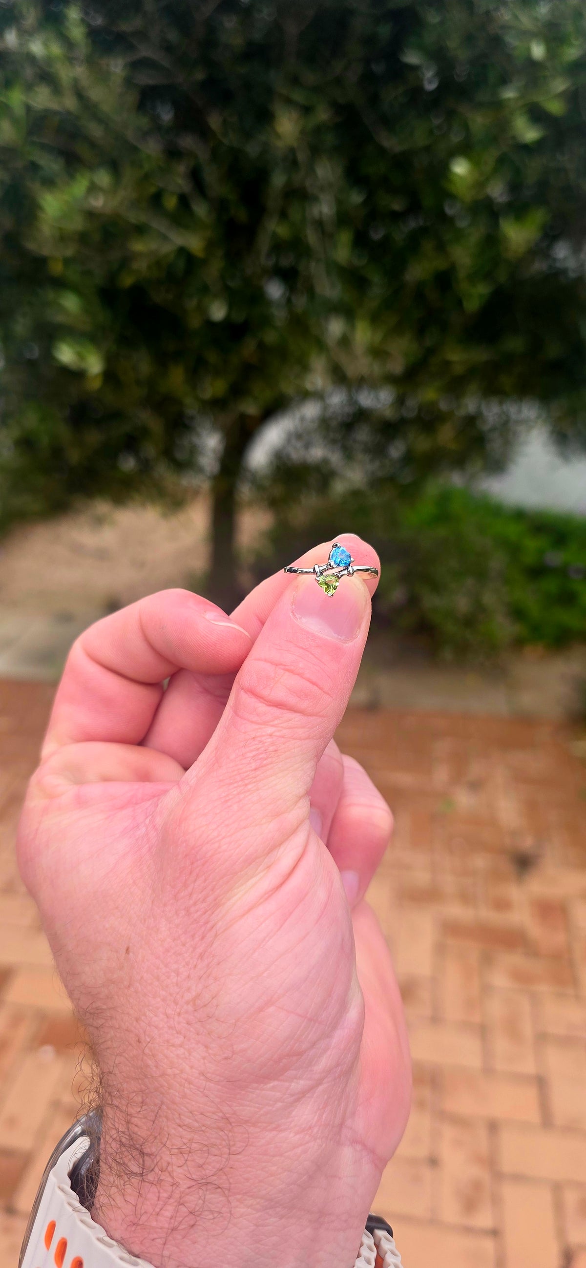 A beautifully dainty and feminine sterling silver Toi et Moi bypass ring, featuring two gorgeous fancy heart-cut gemstones nestled together in a wonderfully romantic design!