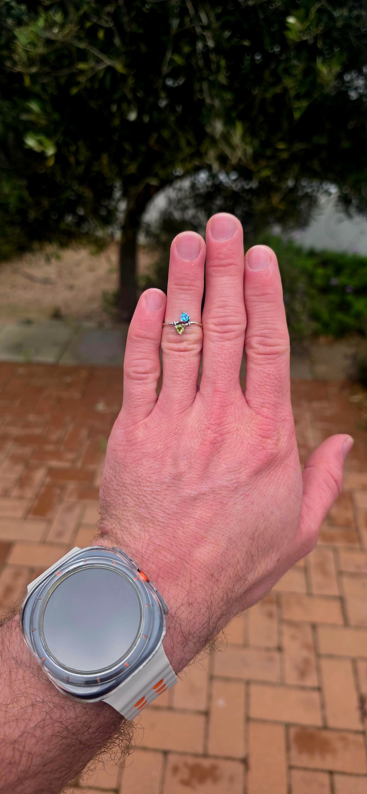 A beautifully dainty and feminine sterling silver Toi et Moi bypass ring, featuring two gorgeous fancy heart-cut gemstones nestled together in a wonderfully romantic design!