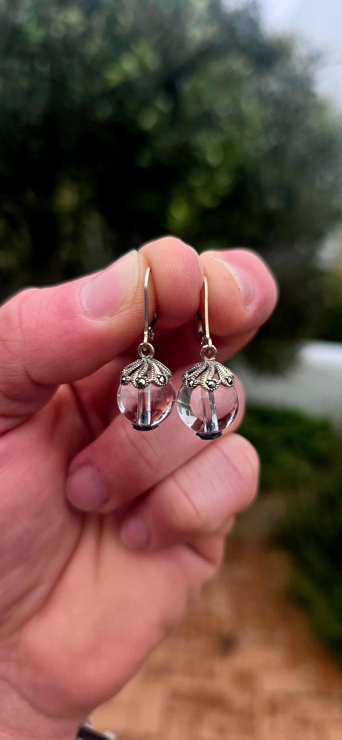 A beautifully feminine pair of Art Deco revival sterling silver Pools of Light drop earrings, combining the beauty of clear rock crystal with delicate vintage-inspired detailing!